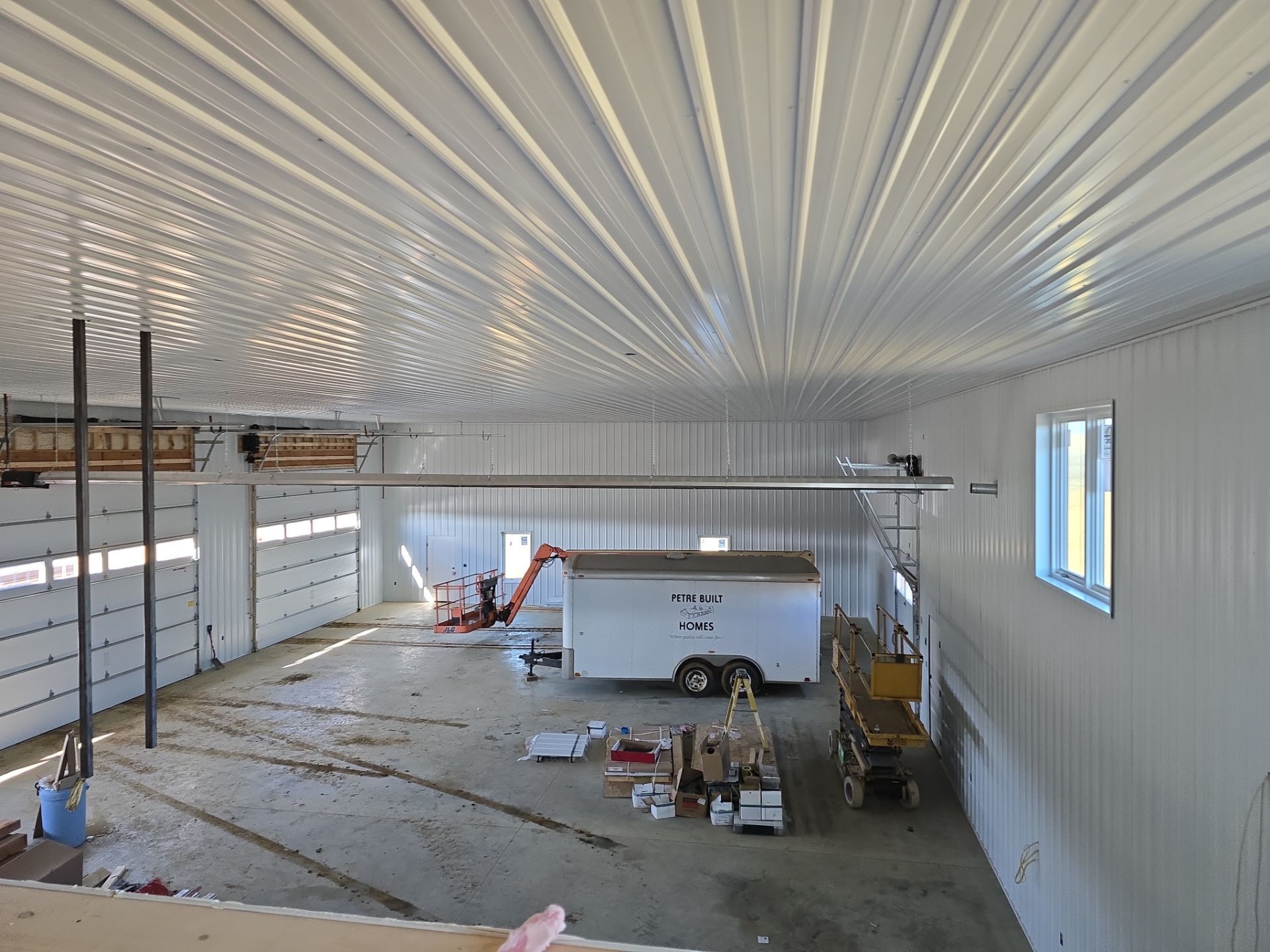 New Home construction w/ board and batten sides and metal roof  by Miles Construction 