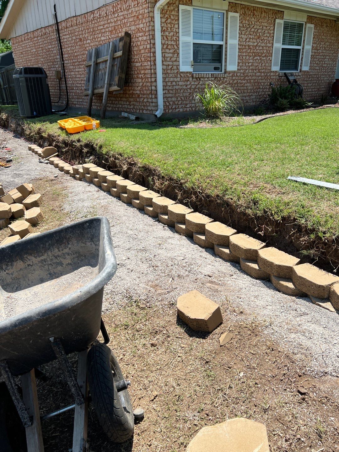 Retaining Wall using Rocks by Clays Services Inc
