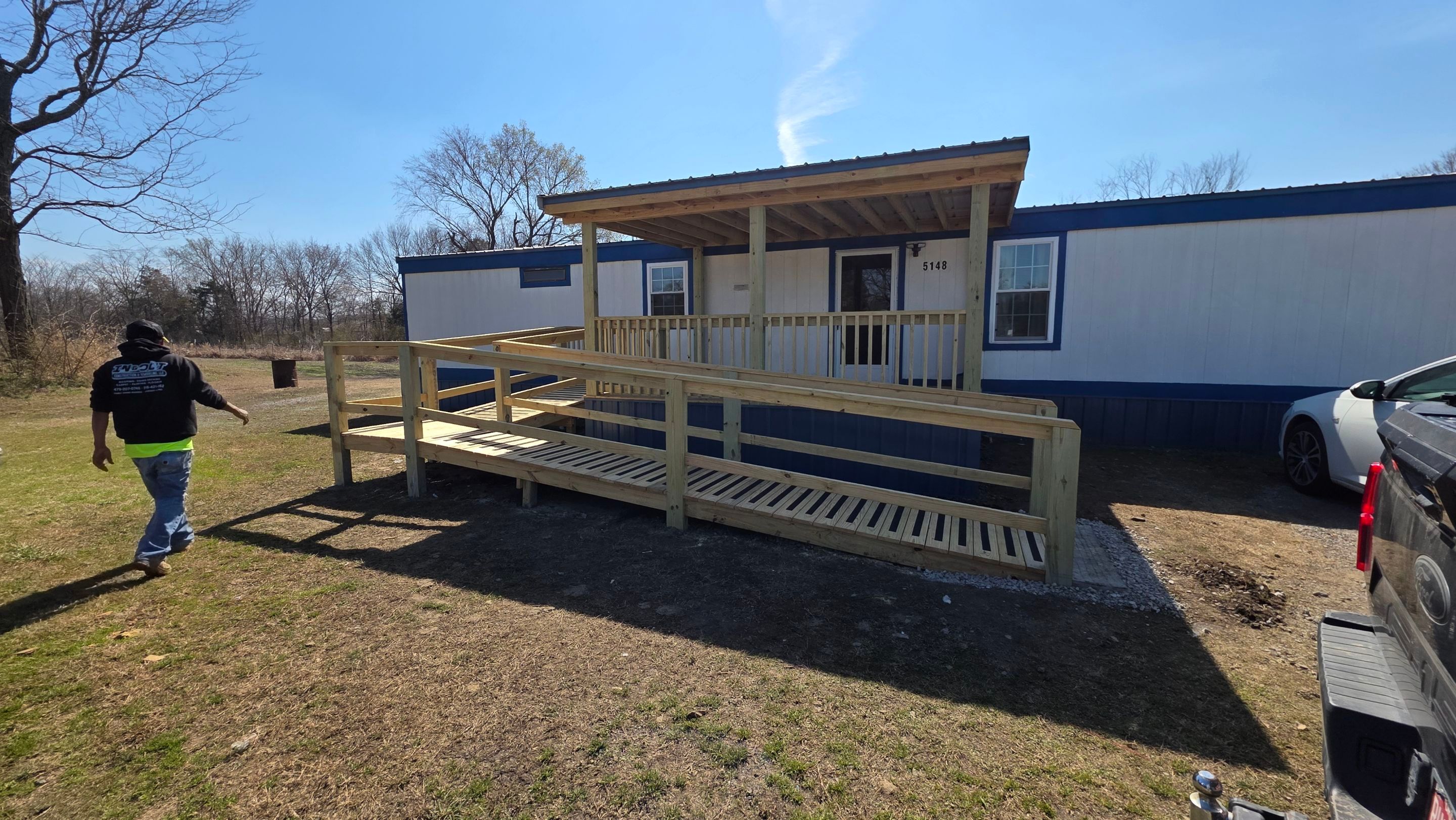 Covered Deck w/ ADA Ramp by In & Out Construction & Remodeling, LLC