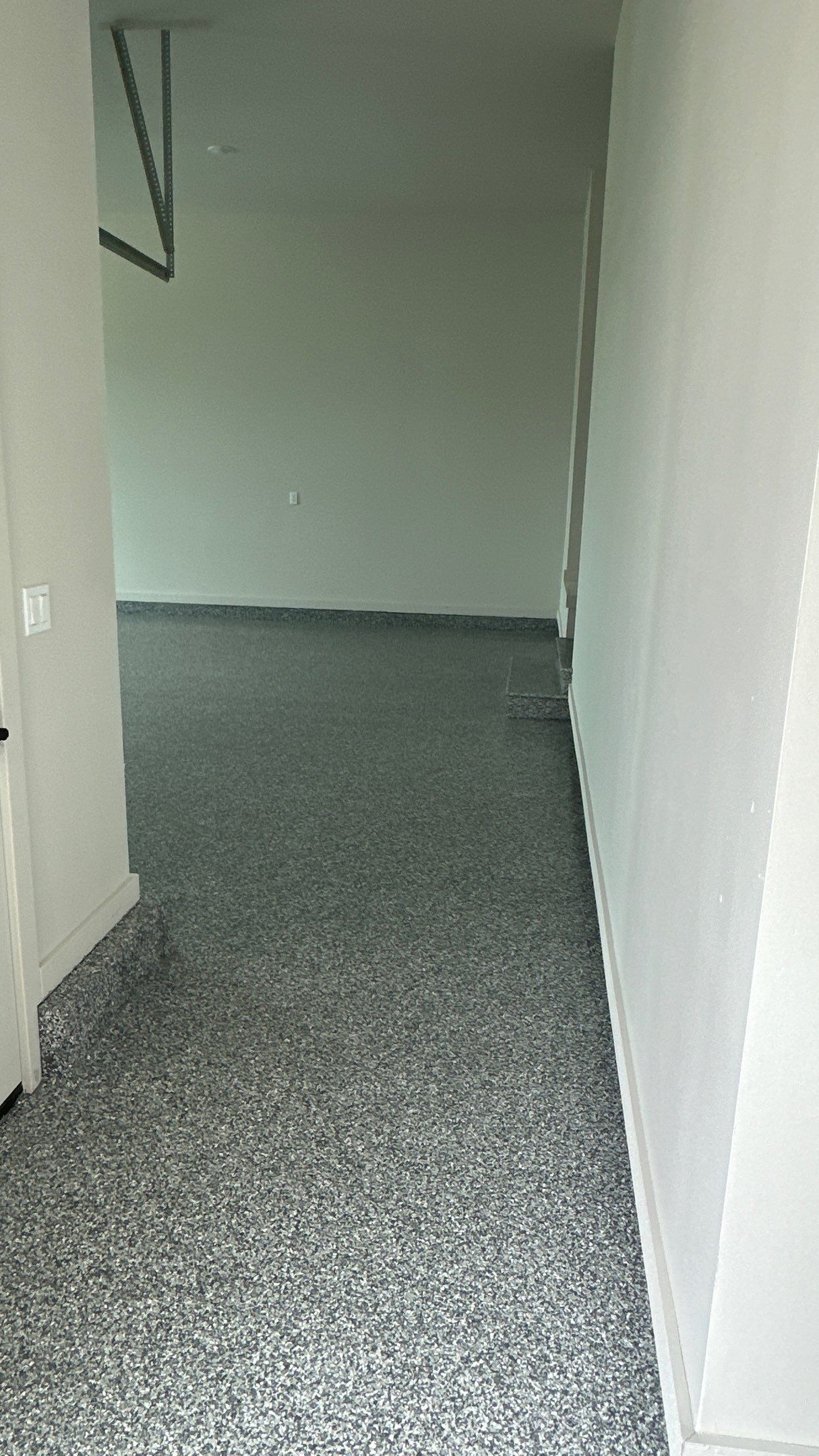 Check out how beautiful a brand new stonehenge flake floor looks by Banner Garage