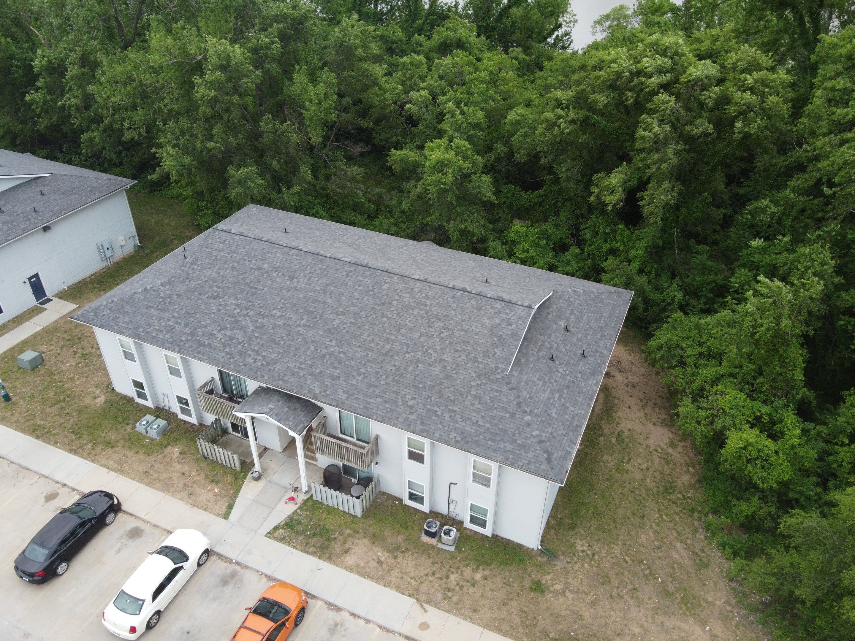 Multifamliy Complex ROOF REPLACEMNT with Ventilation Upgrades using Malarkey Vista Class III IR Shingles by Gorilla Exteriors Contracting, LLC