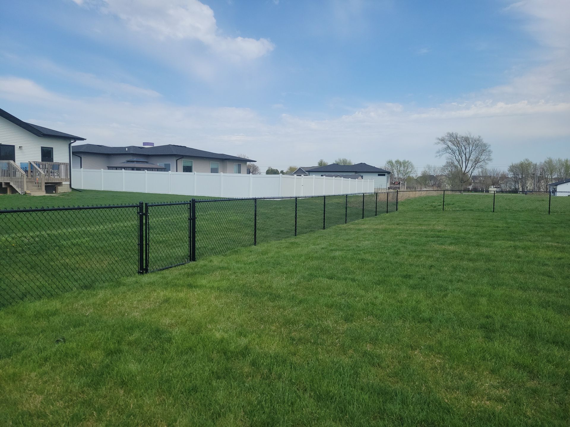 Black Chain Link Fence and Gate Installation in Cedar Falls by Perfect Picket Fence and Stain