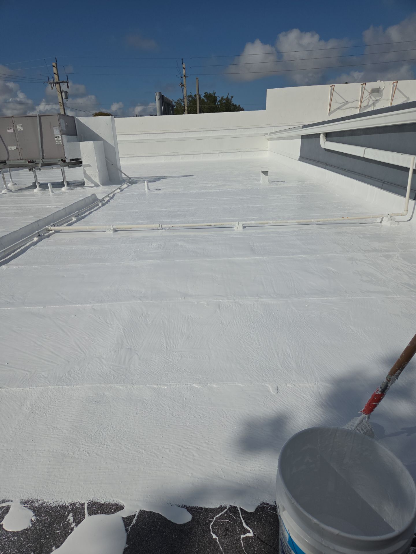 Commercial Flat Roof Restoration Using Silicone Coating in Hallandale Beach by Aastro Roofing