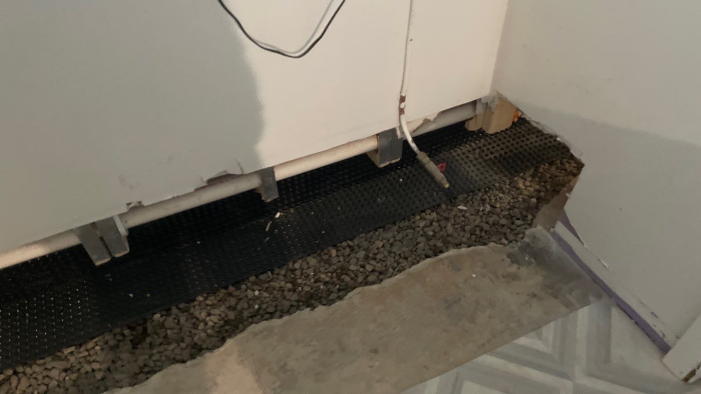 Interior Drain Tile & Buried Discharge in St. Anthony, MN by Waterproofing Northeast