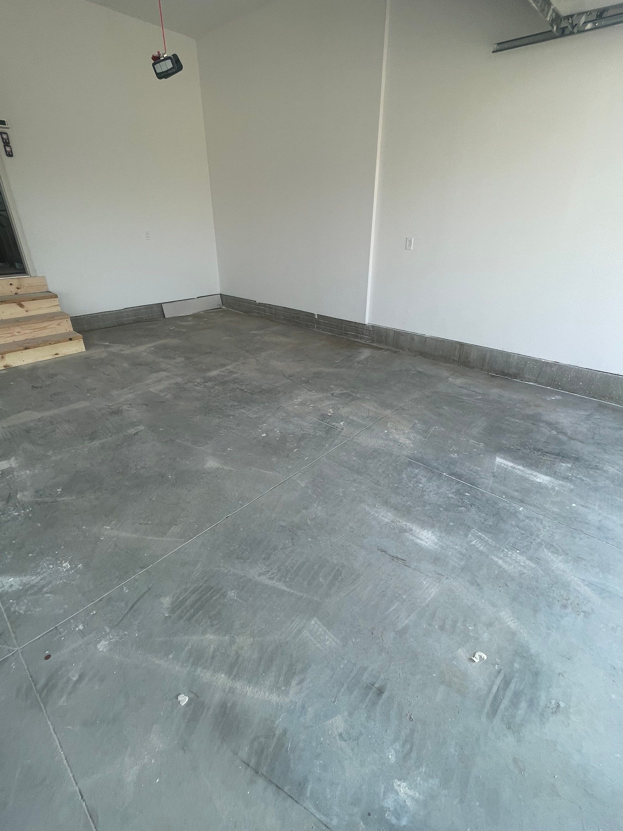 Grey Speckled Garage Floor Coating in Sioux Falls by Select Painting, Coatings & Garage Cabinets