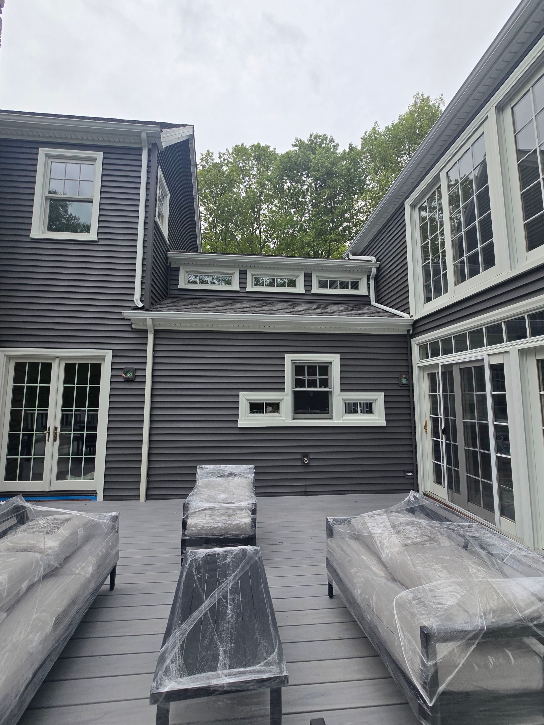 Siding refreshed with Cert. Monogram D/4 x 12'6" clapboard, Smoky Gray and Stone Facade, Coastal Gray by DiGiorgi Roofing and Siding Inc