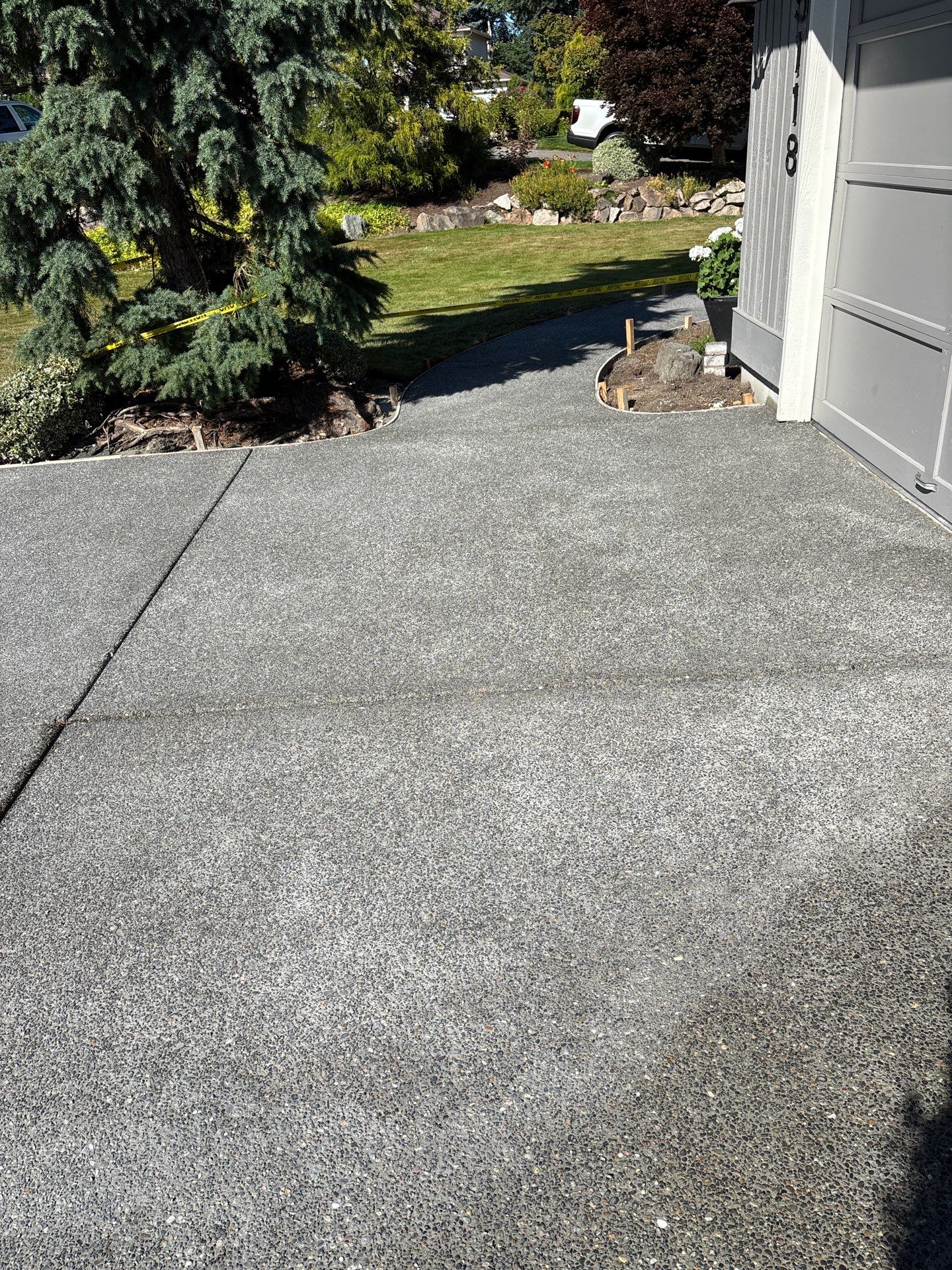 Exposed Aggregate Concrete Driveway Makeover  by Jireh Asphalt & Concrete Inc 