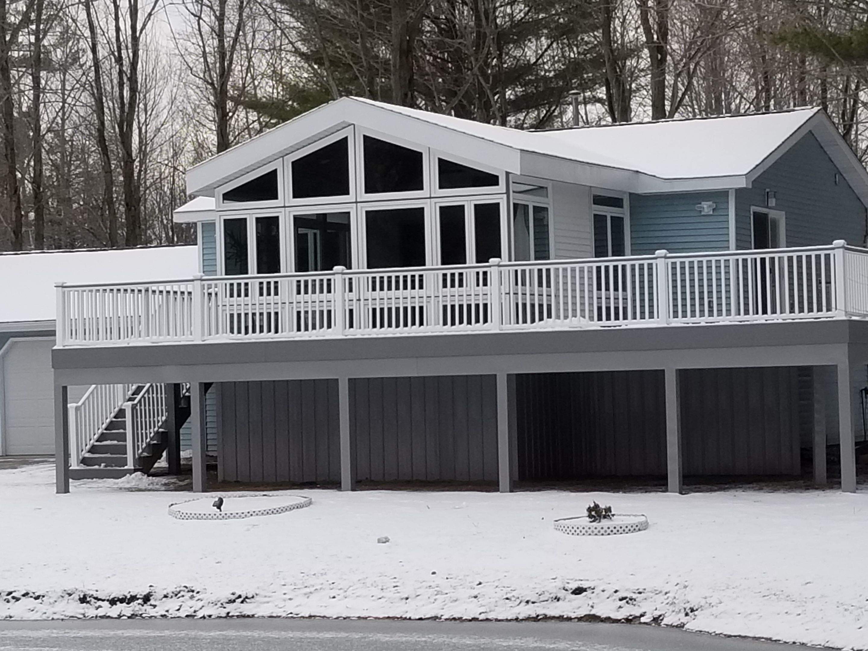 Sunroom and deck addition. by Energy Plus Home Improvements