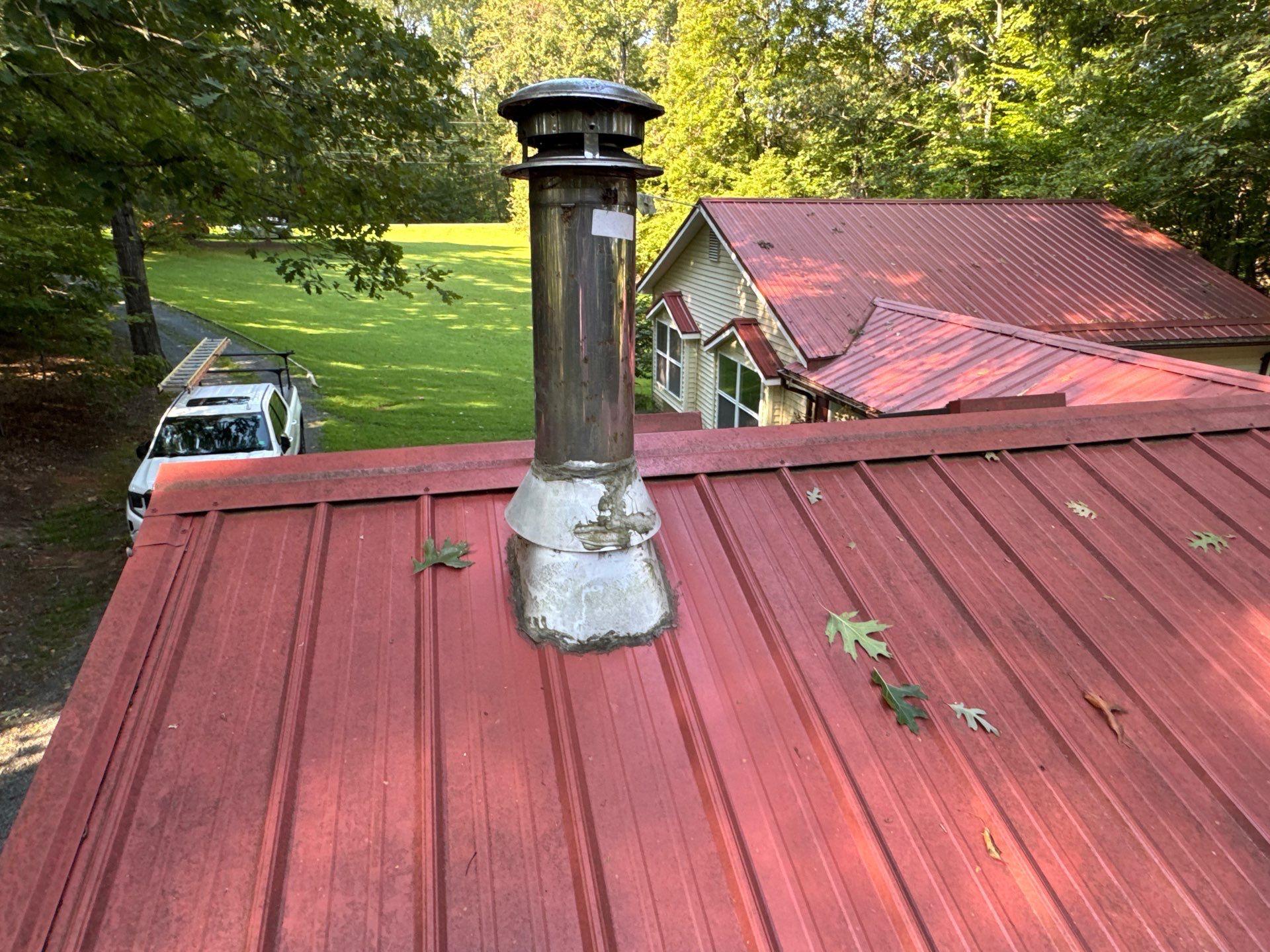 Red Metal Roof Restoration and Wood Fascia Replacement in Barboursville by Cade Construction