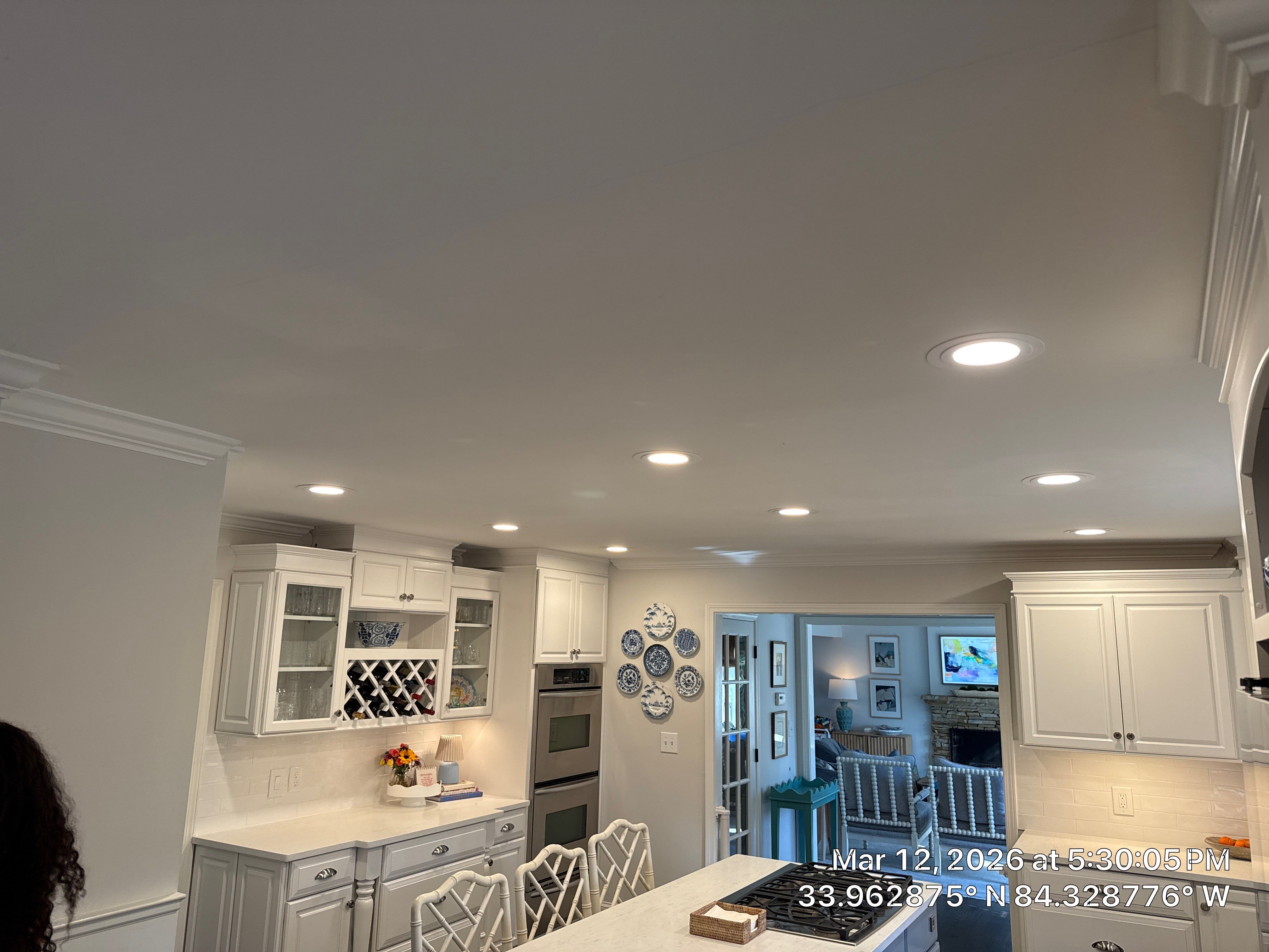 Kitchen Remodel in Dunwoody Featuring White Cabinetry and Blue Island by Heart & Home Kitchen & Bath Remodeling LLC