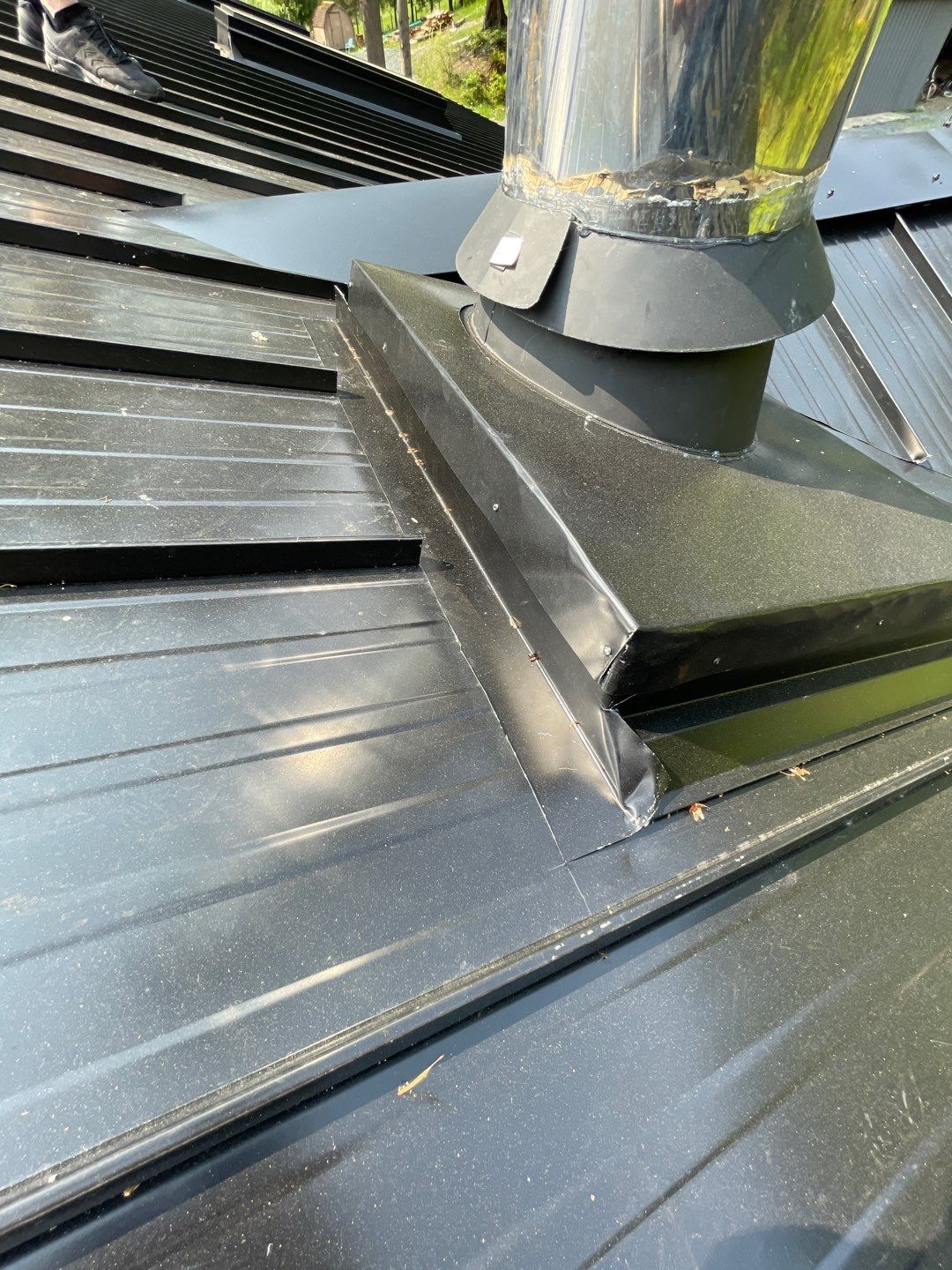 Residential ReRoofing Installation using 12" Prolok metal by Top Notch Roofing Inc