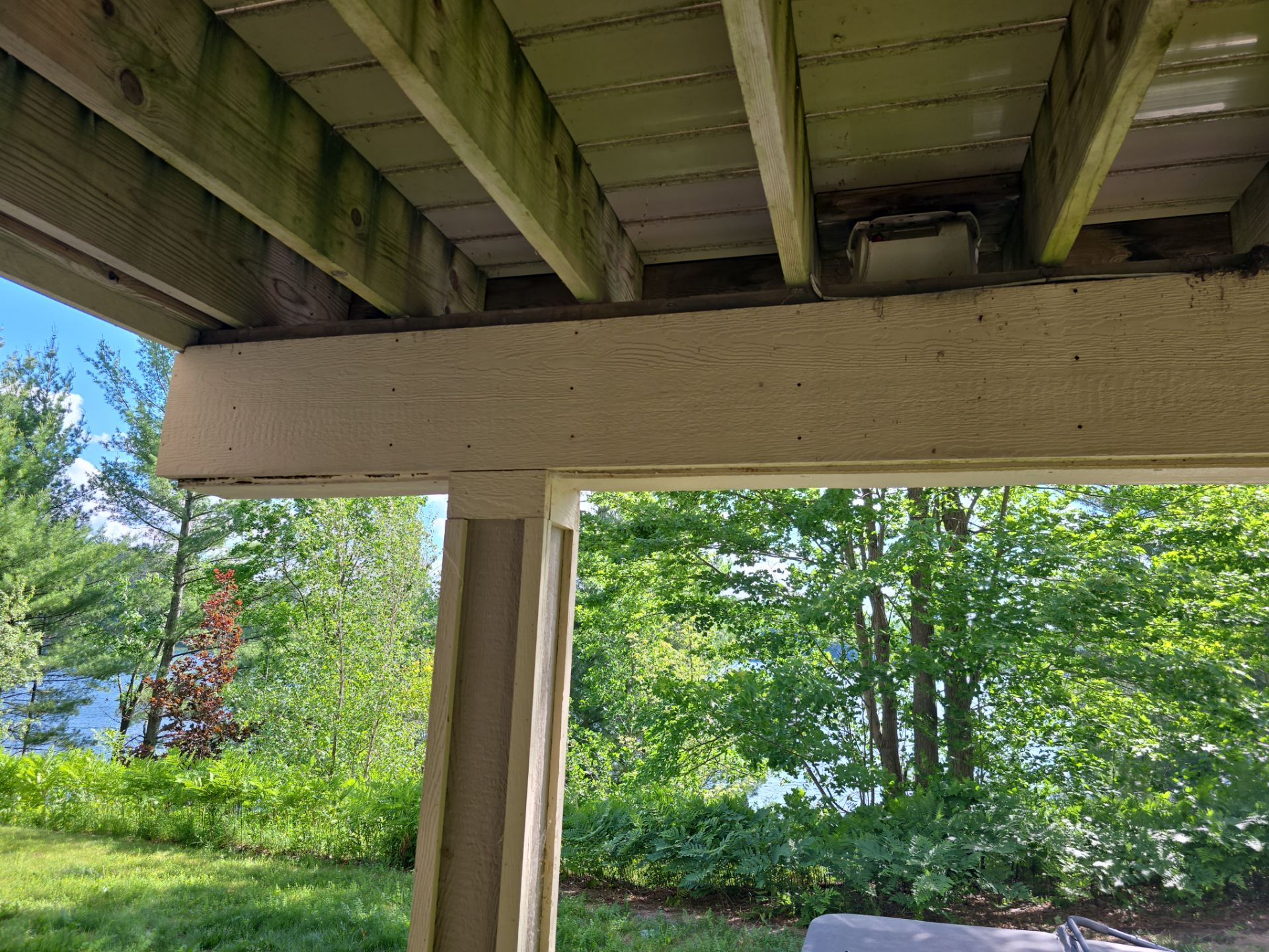Traverse City Underdecking Installation with Integrated Seamless Gutter System by Rainbow Seamless Systems