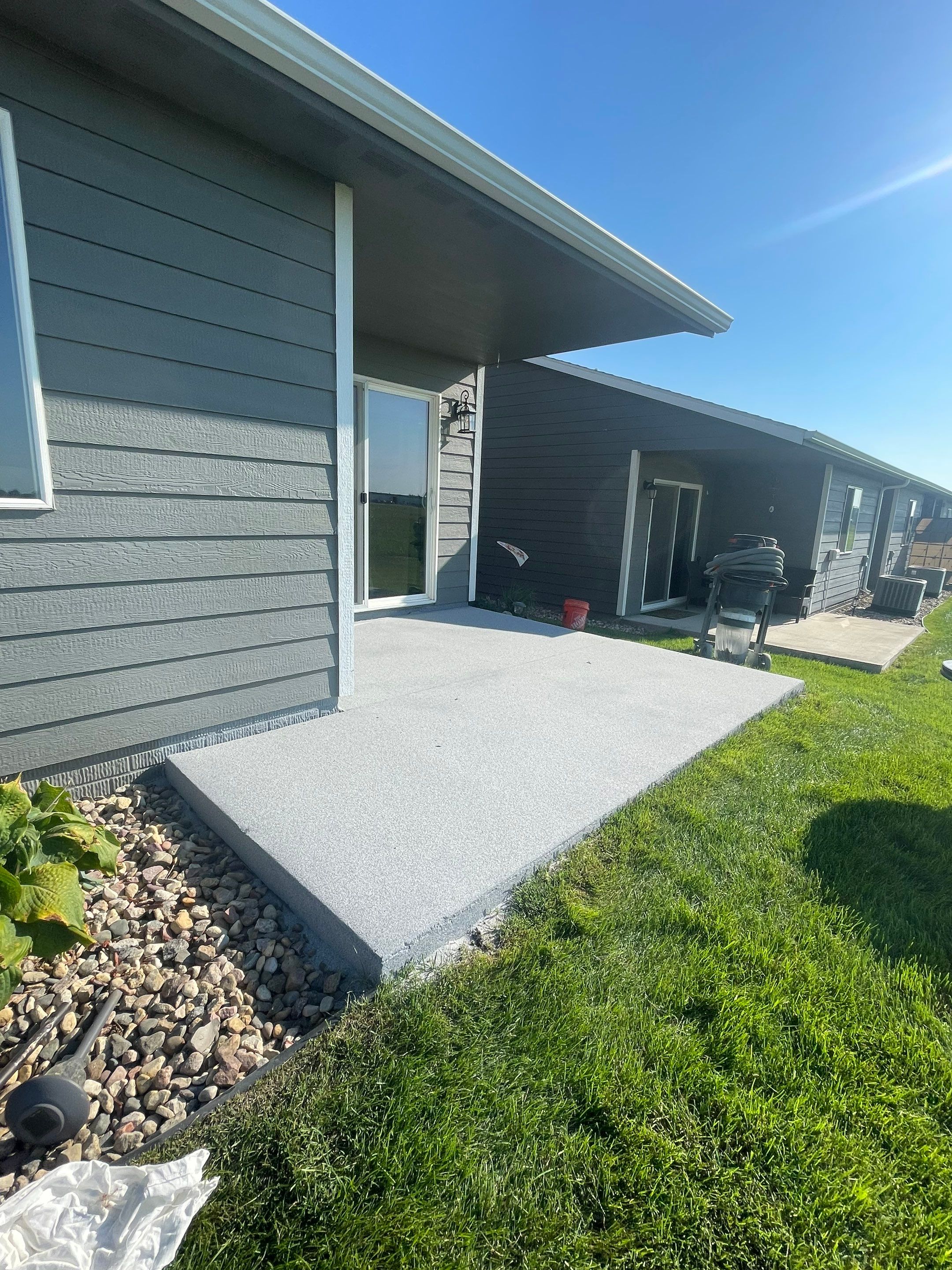 Starry Evening Concrete Patio Coating Installation in Tea by Select Painting, Coatings & Garage Cabinets