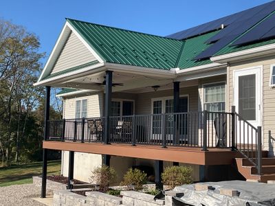Green Metal Roof and Custom Covered Deck in Duncannon
