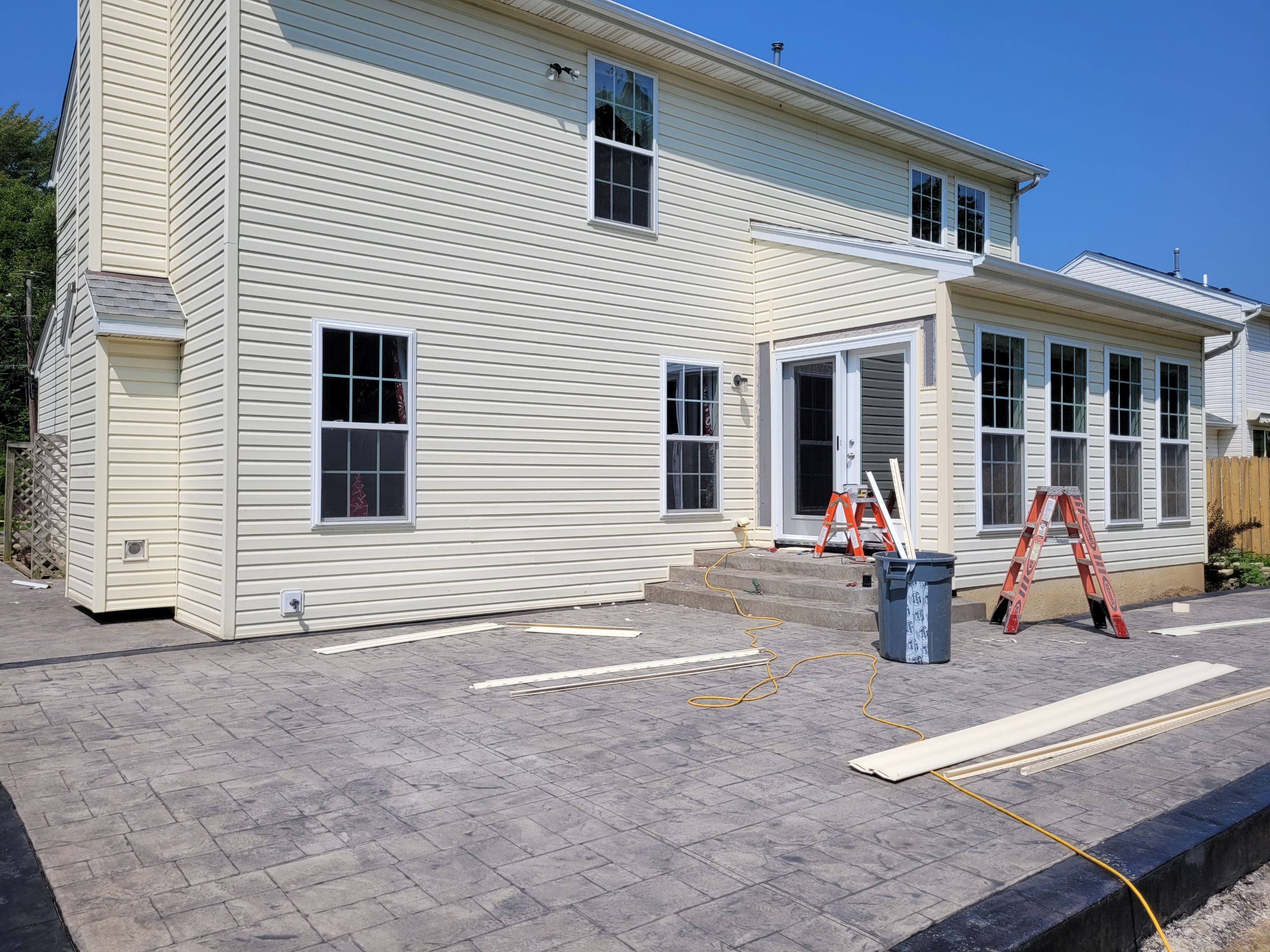 Stamped Concrete, Entry Door, and Concrete  by Ivy Lea Construction