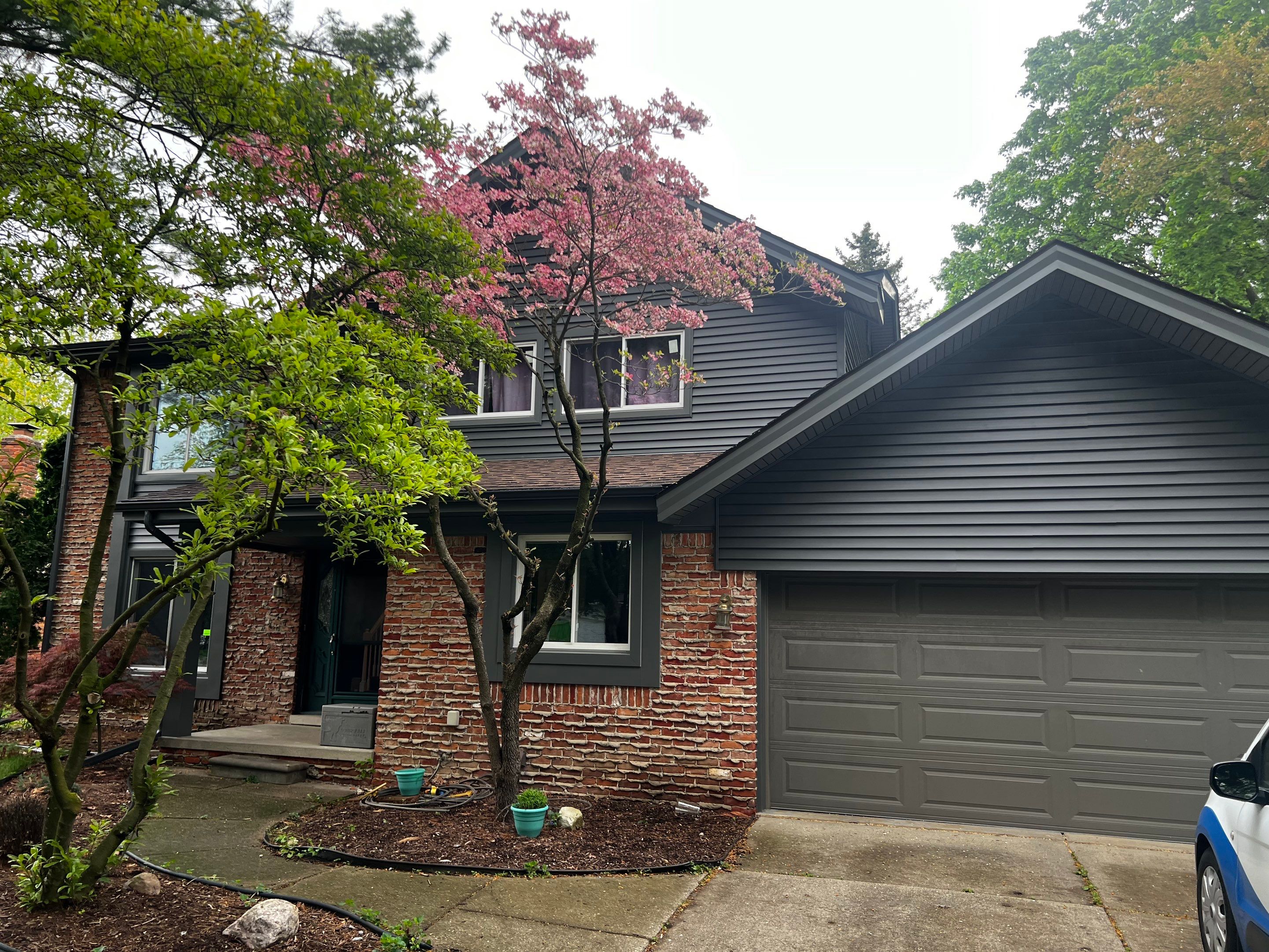 Siding Replacement  using Certainteed Monogram Vinyl D4" Smoky Gray color by Bloomfield Construction & Restoration