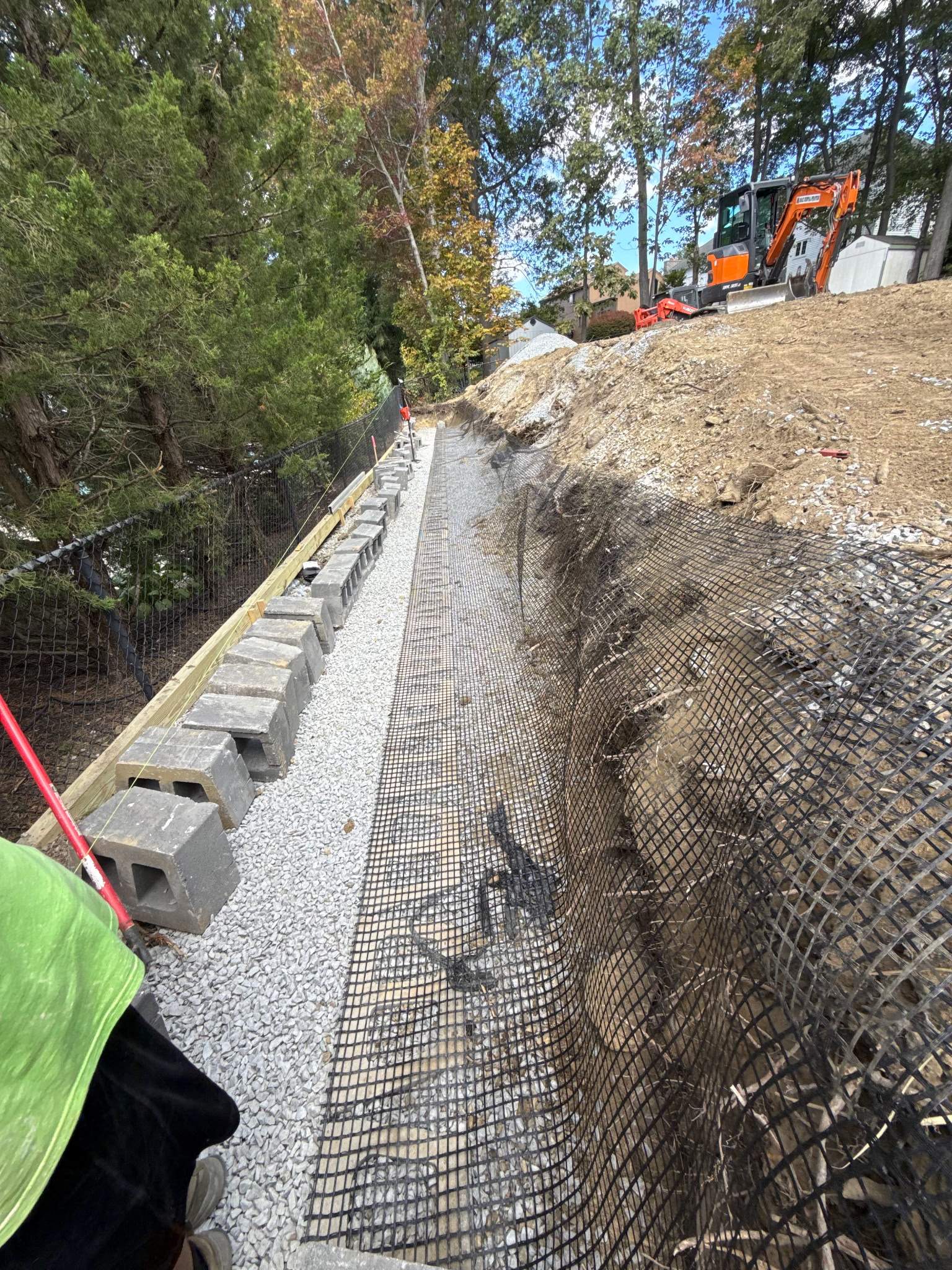 Retaining Wall to Level Backyard  by May Property Management 
