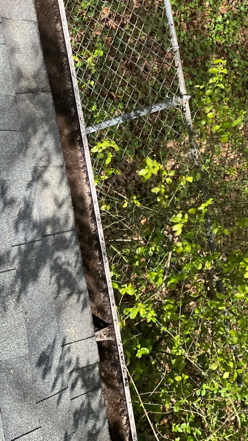 Gutter Cleaning using brown bags by Roof Bullies