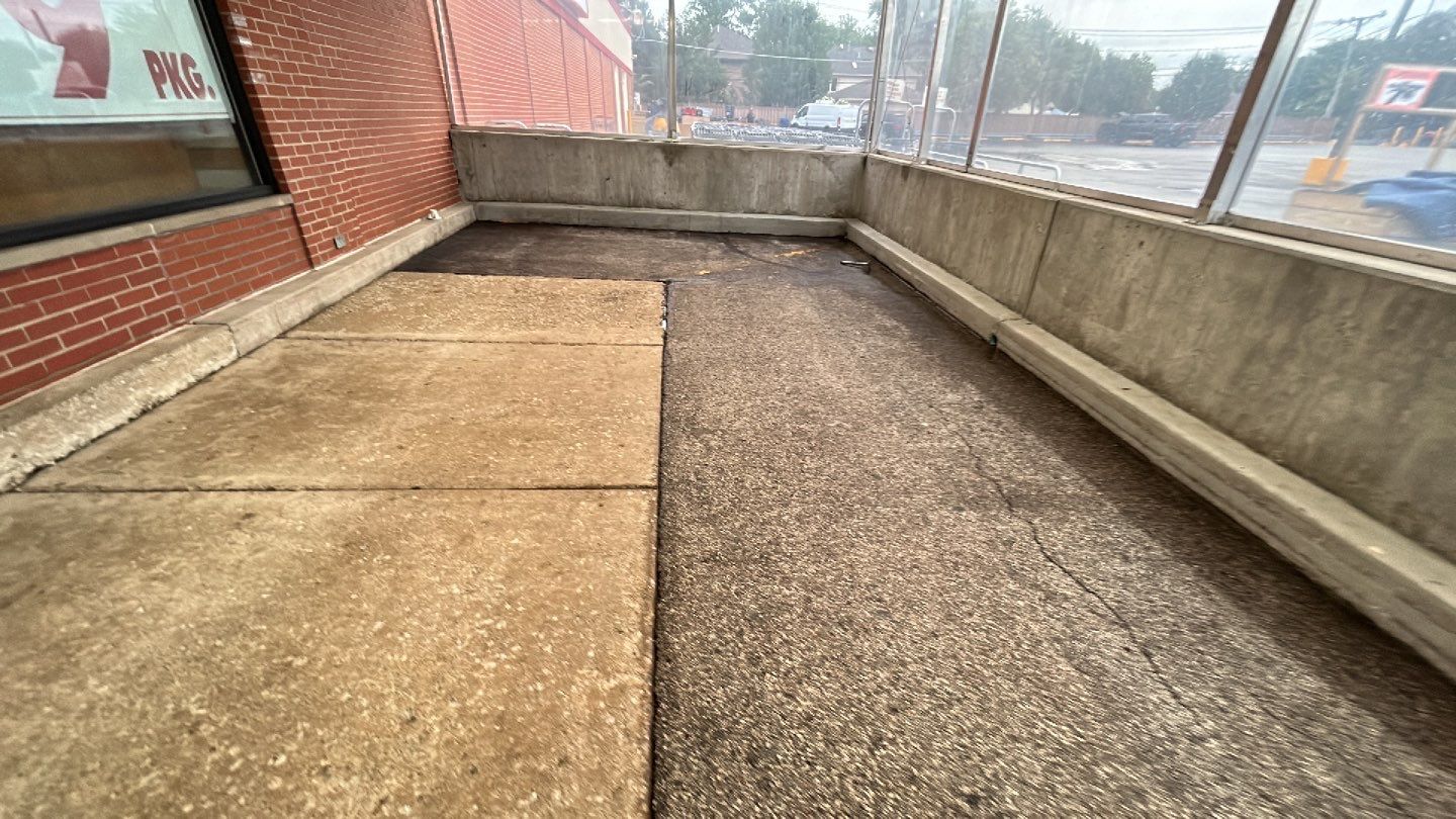 Concrete sidewalk cleaning and degreasing by Northern Power Washing LLC.