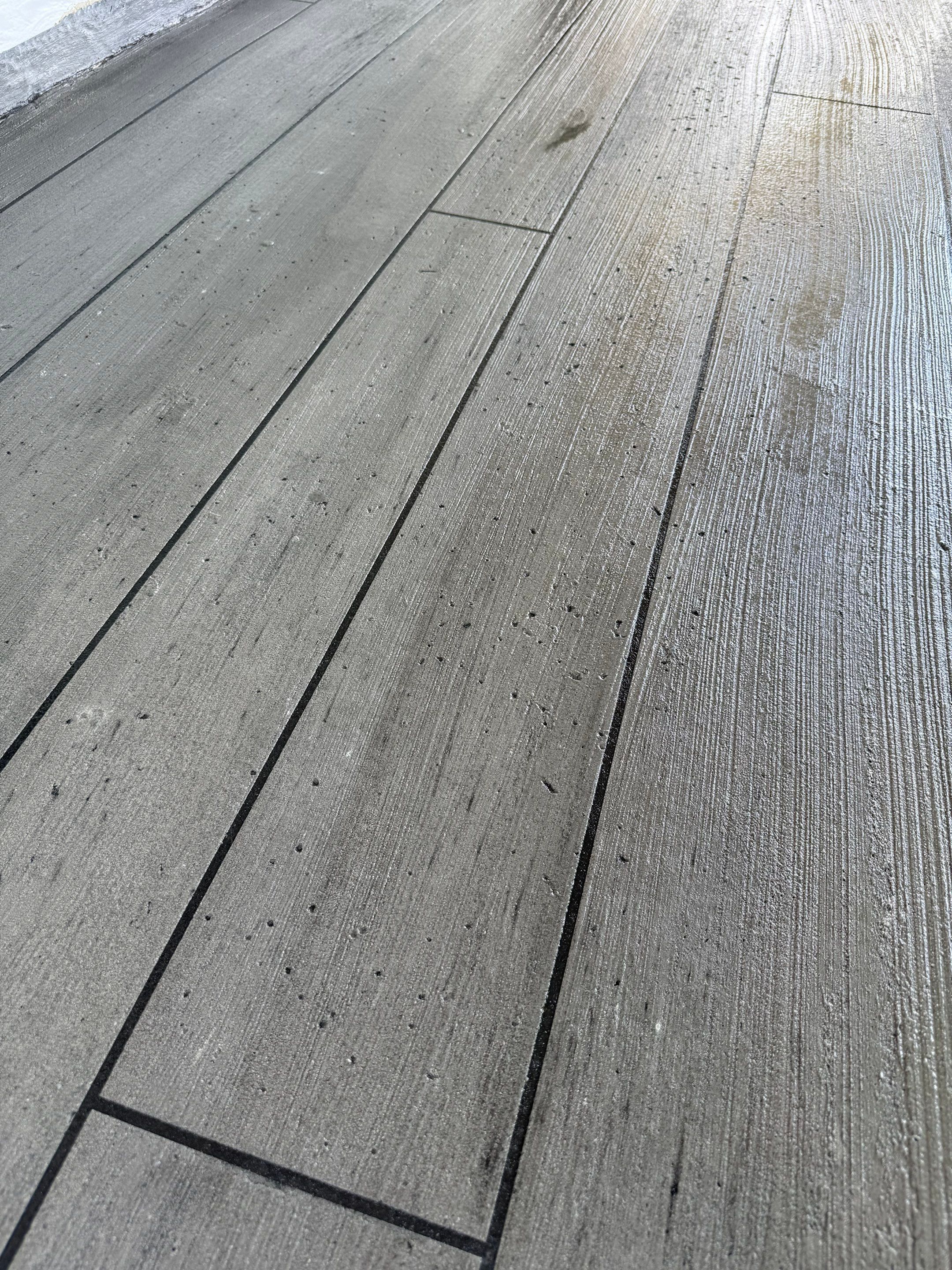 Wood-Grain Stenciled Concrete Porch Resurfacing in Mobile by Cornerstone Hard Surface Restoration 