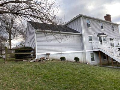 New Gutters and Downspouts