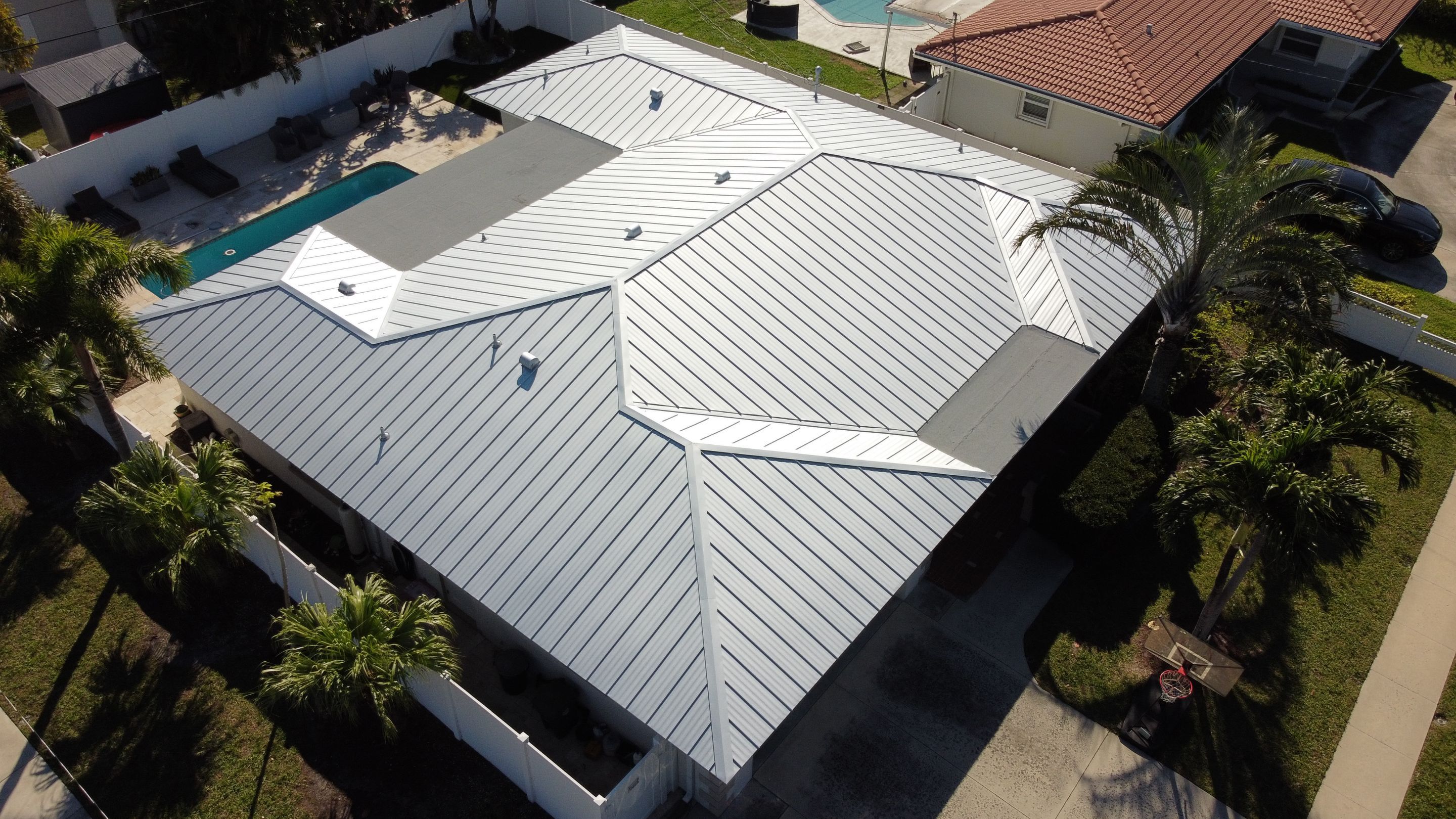 Residential Roofing Installation using 1" Nail strip metal roof by BLUES BROTHERS CONSTRUCTION CORP