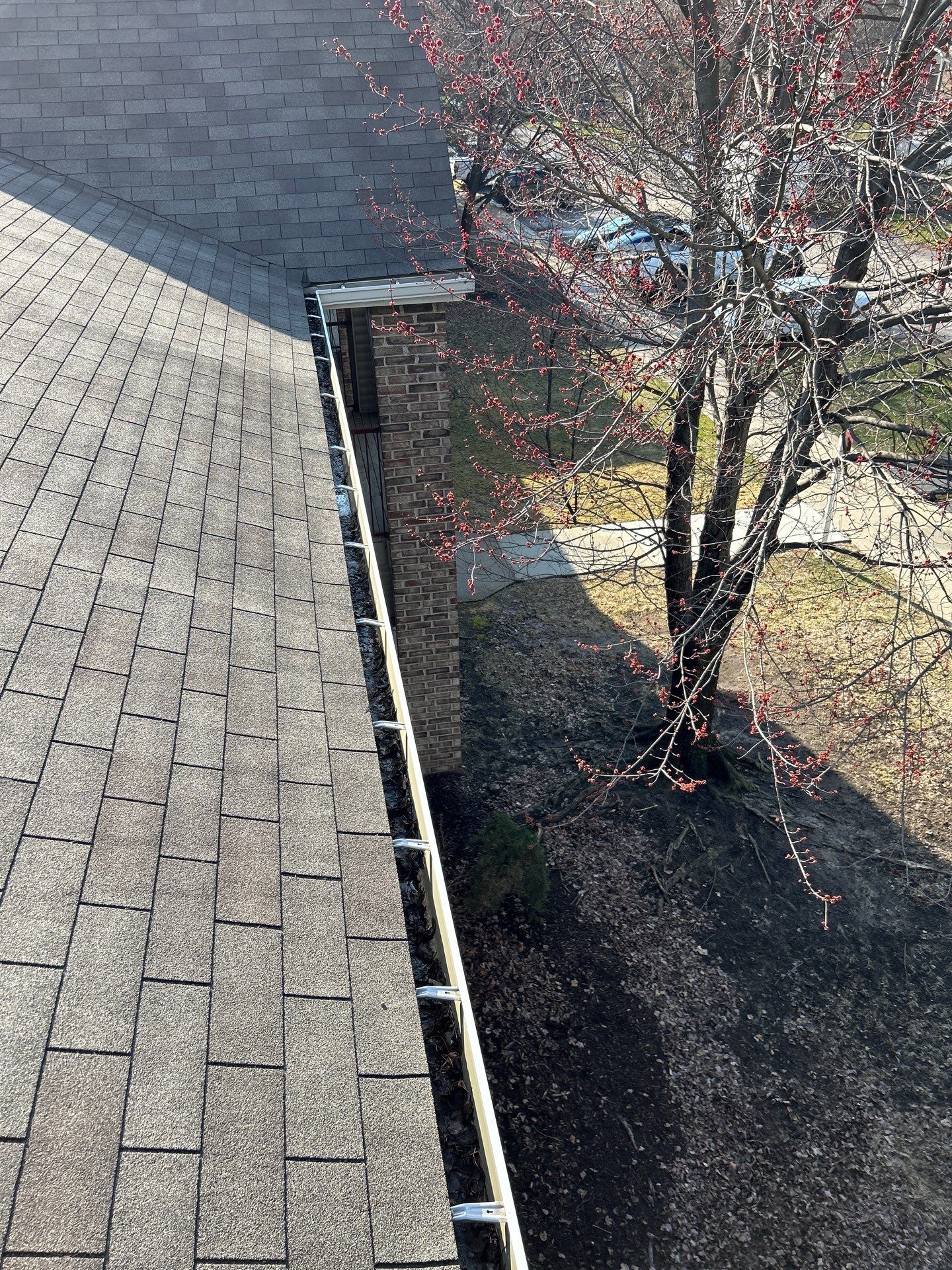 Commercial gutter cleaning Westland, MI before photo with filled gutters