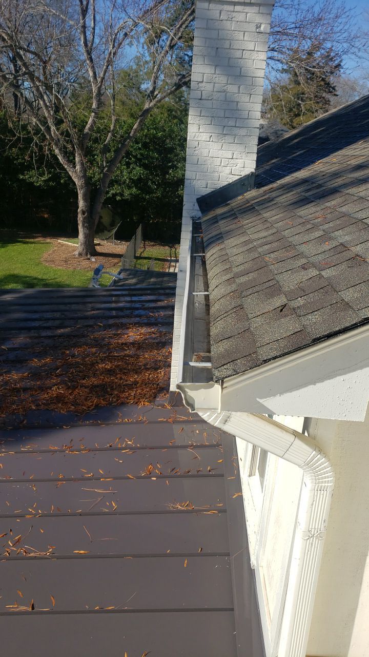 Sara Gutter cleanout using water by Power Wash Masters LLC