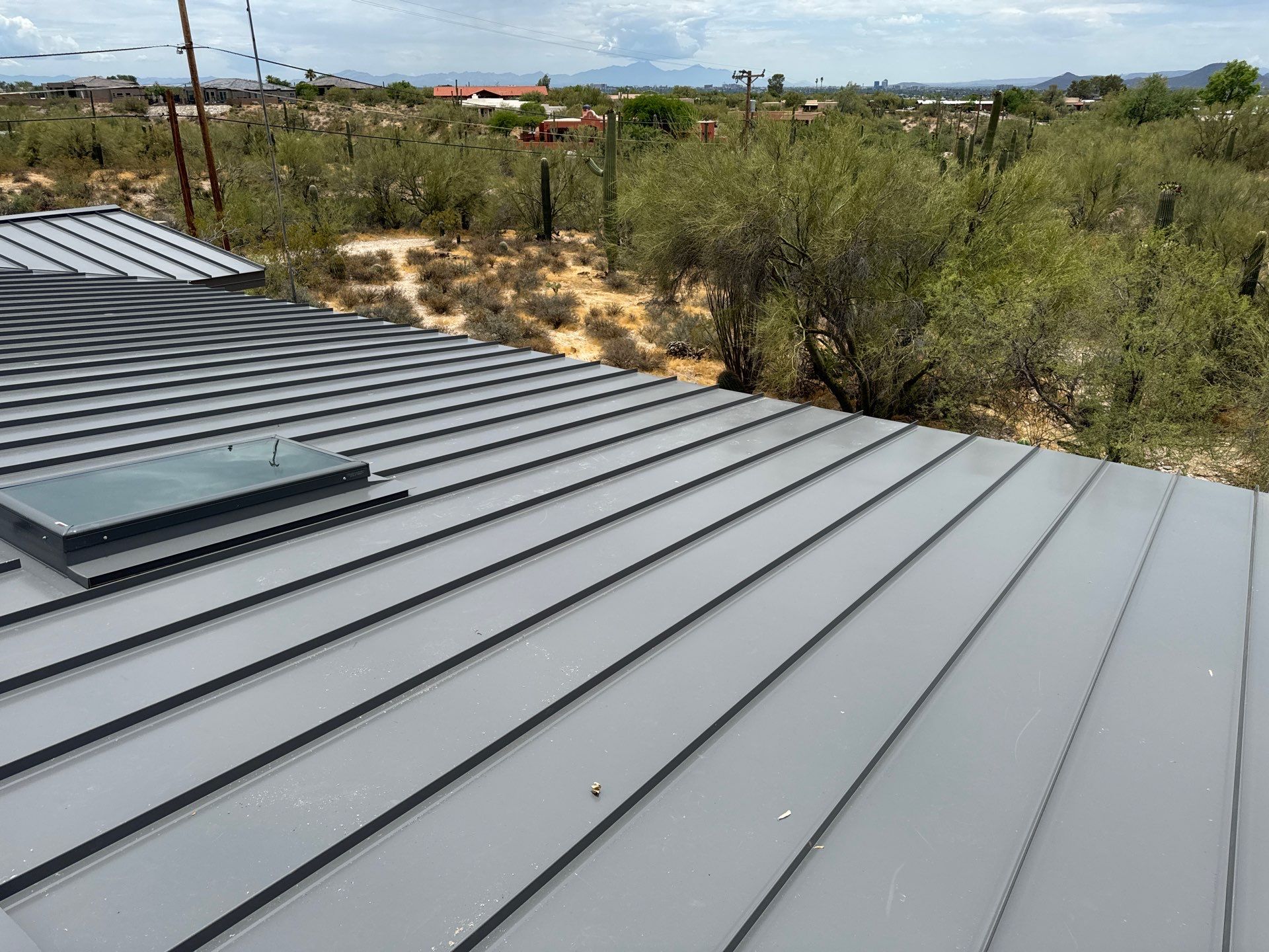 Charcoal Gray Standing Seam by Reimagine Roofing