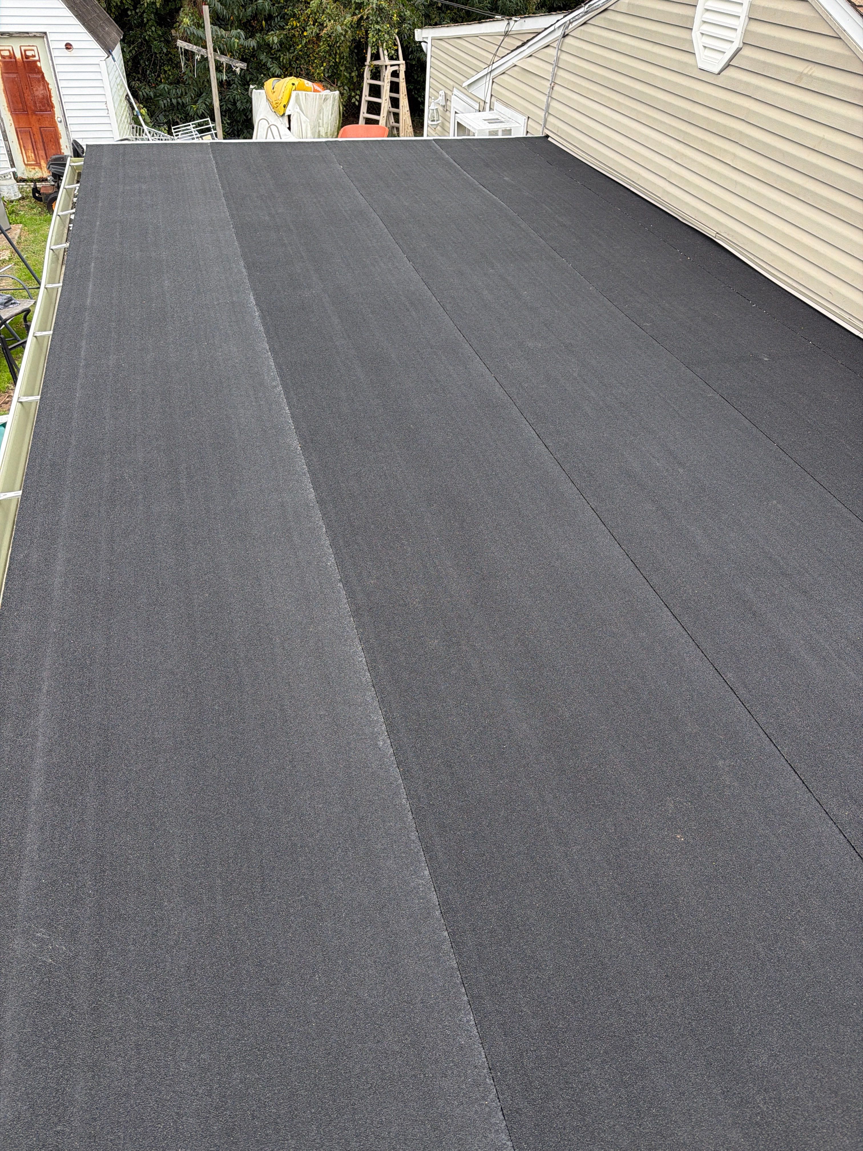 Flat Roof Replacement and Shingle Integration in Levittown by Stofan Construction LLC