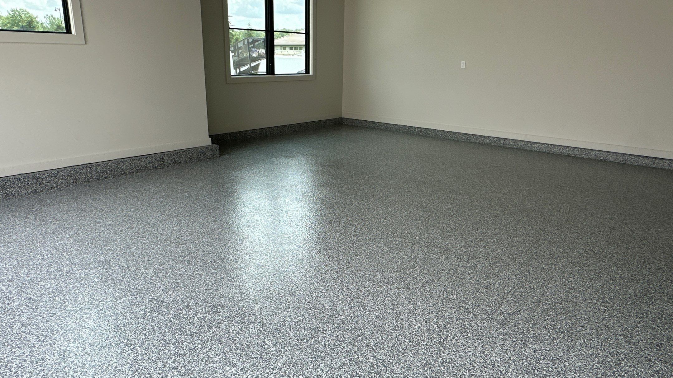 Check out how beautiful a brand new stonehenge flake floor looks by Banner Garage
