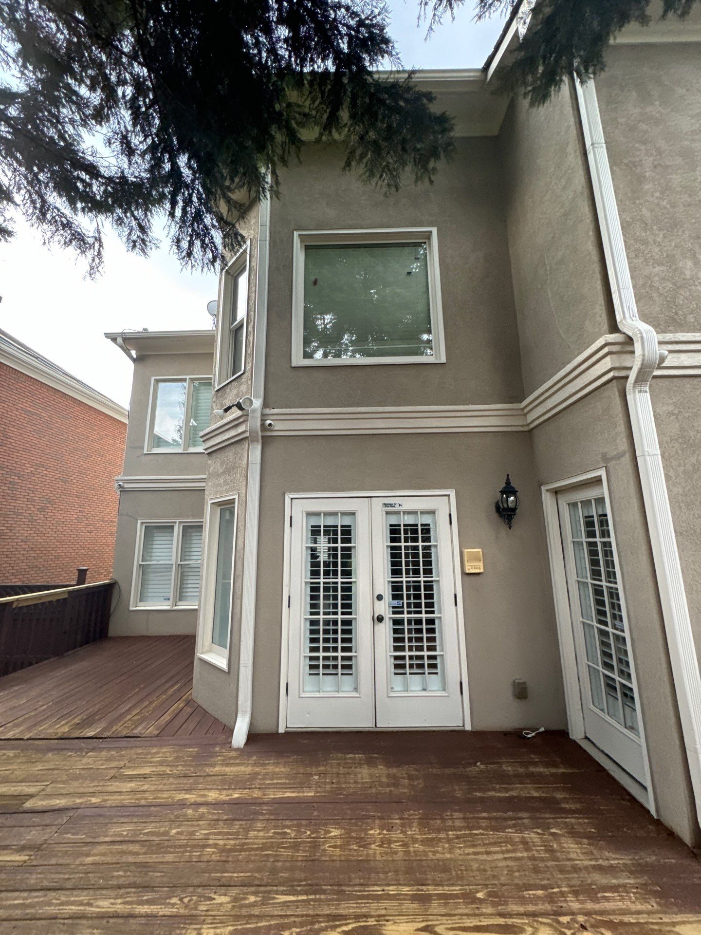 Full Exterior Stucco Painting and Wood Deck Staining in Atlanta by Swift Home Renovations