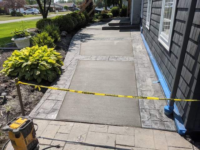 Exterior Renovations- Siding, Concrete, Railings, and Entry Door  by Ivy Lea Construction