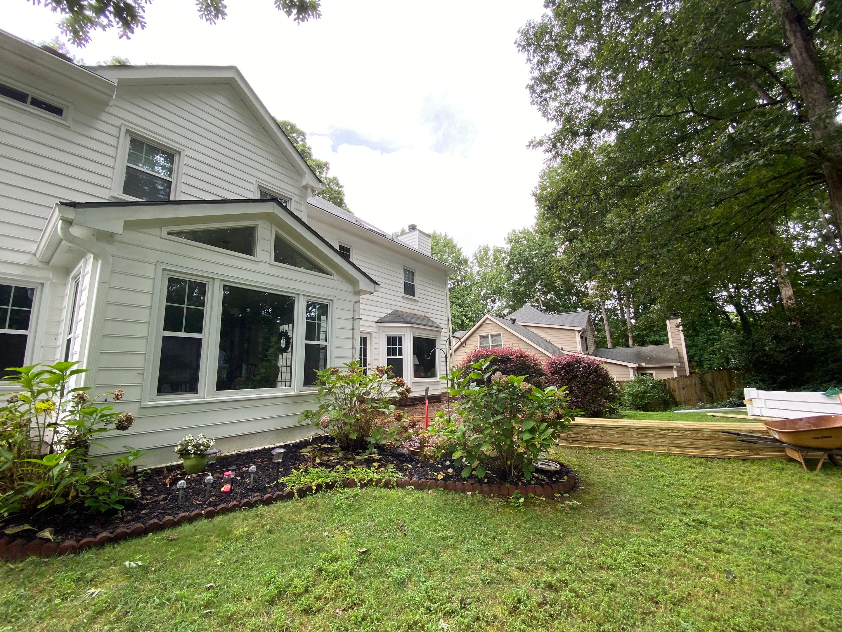 Custom Screened Porch with Beadboard Ceiling and Composite Decking by Swift Home Renovations