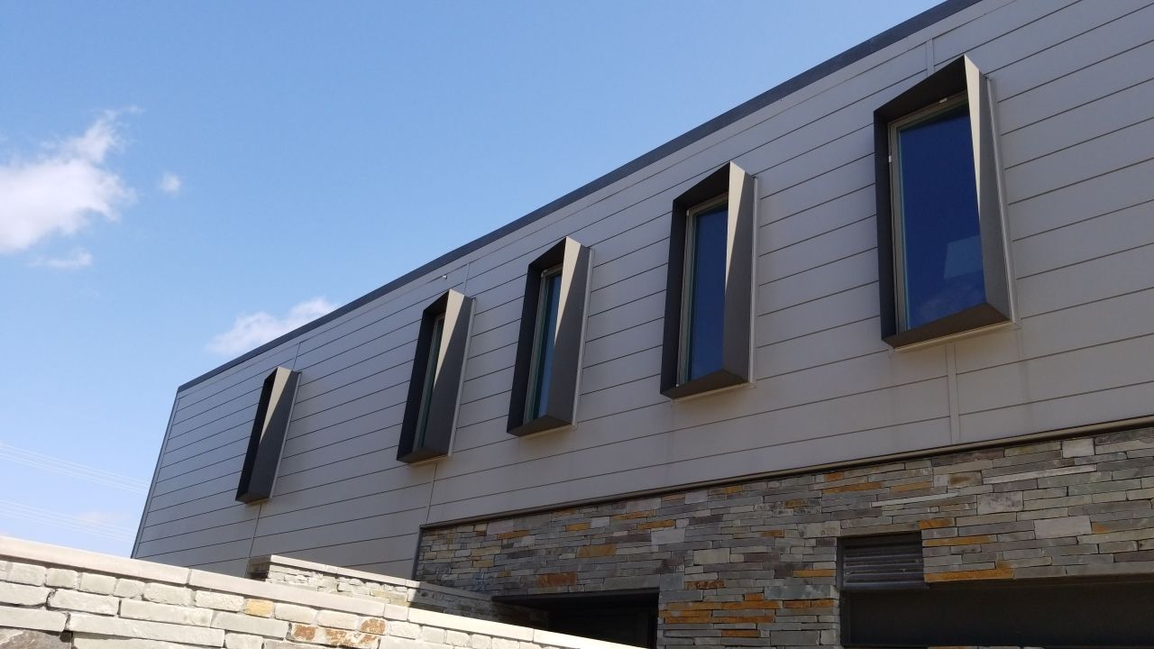 Metal Roofing project using MBCI Flexloc Panels - 22 gauge - silver metallic-in-color by Becker Roofing and Exteriors