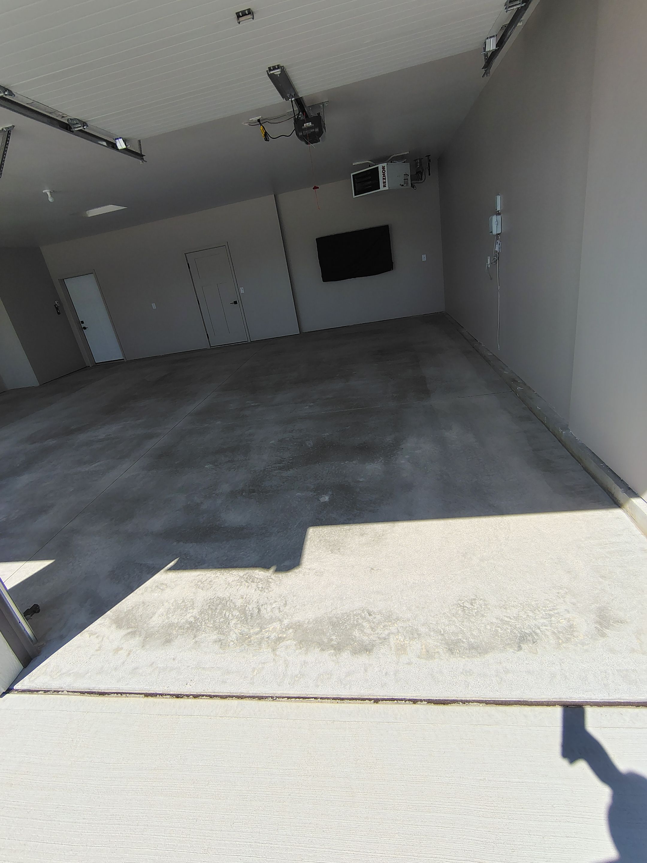 Full Speckled Concrete Coating for Sioux Falls Garage by Select Painting, Coatings & Garage Cabinets
