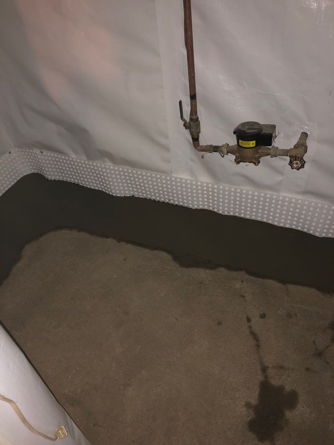 Basement Waterproofing using Drain tile system and a foundation wrap by ACE Waterproofing & Basement Solutions