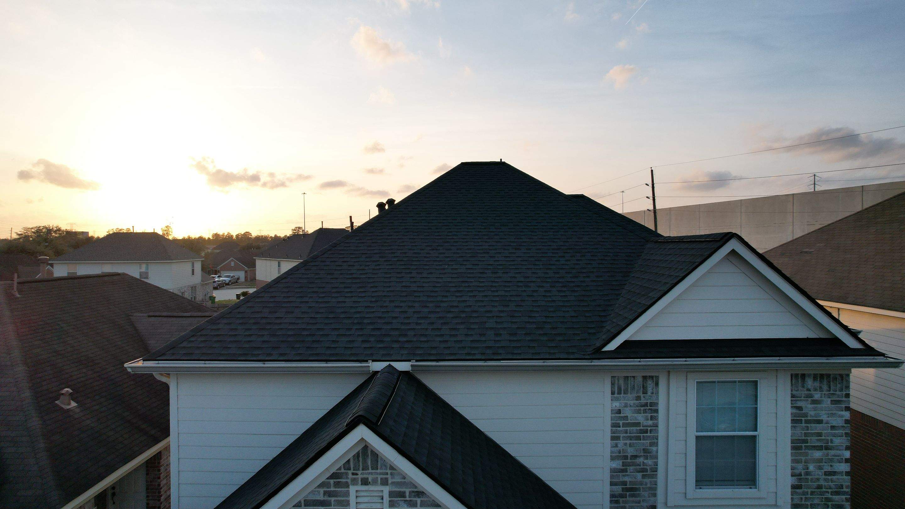 Slate-Gray Roof on Stone-Front Home — Spring, TX by PL Roofing & SB Roofing, LLC.