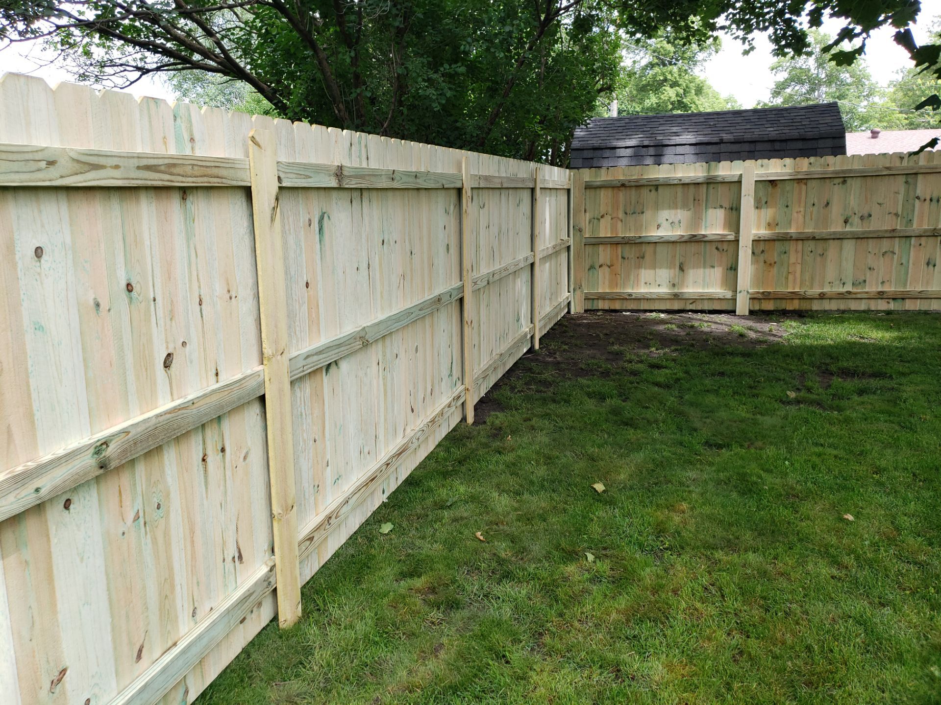 Custom Wood Privacy Fence Installation for Charles City Backyard by Perfect Picket Fence and Stain