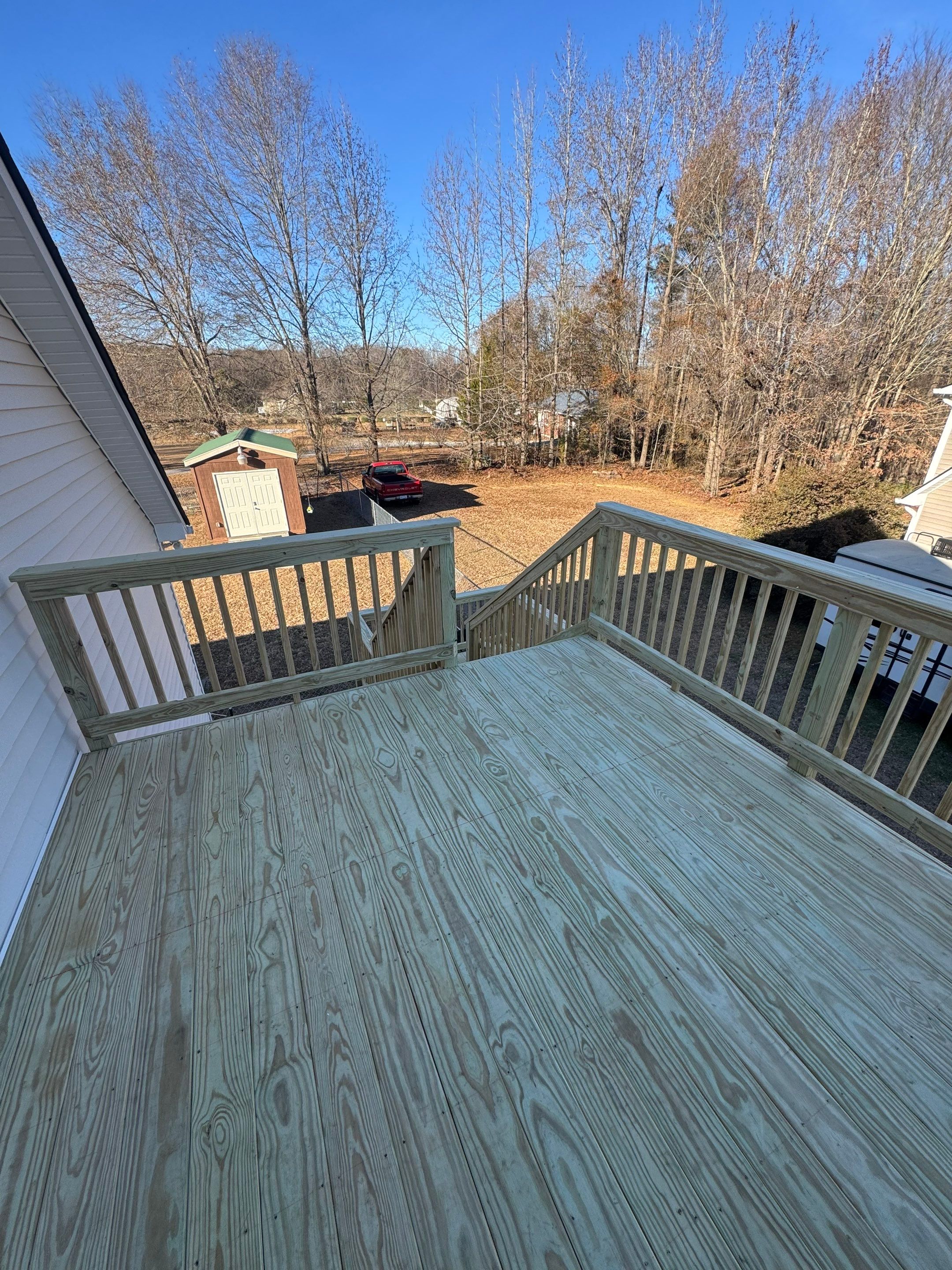 Elevated Pressure-Treated Wood Deck and Sliding Glass Door Installation in Clayton by The Remodeling Company