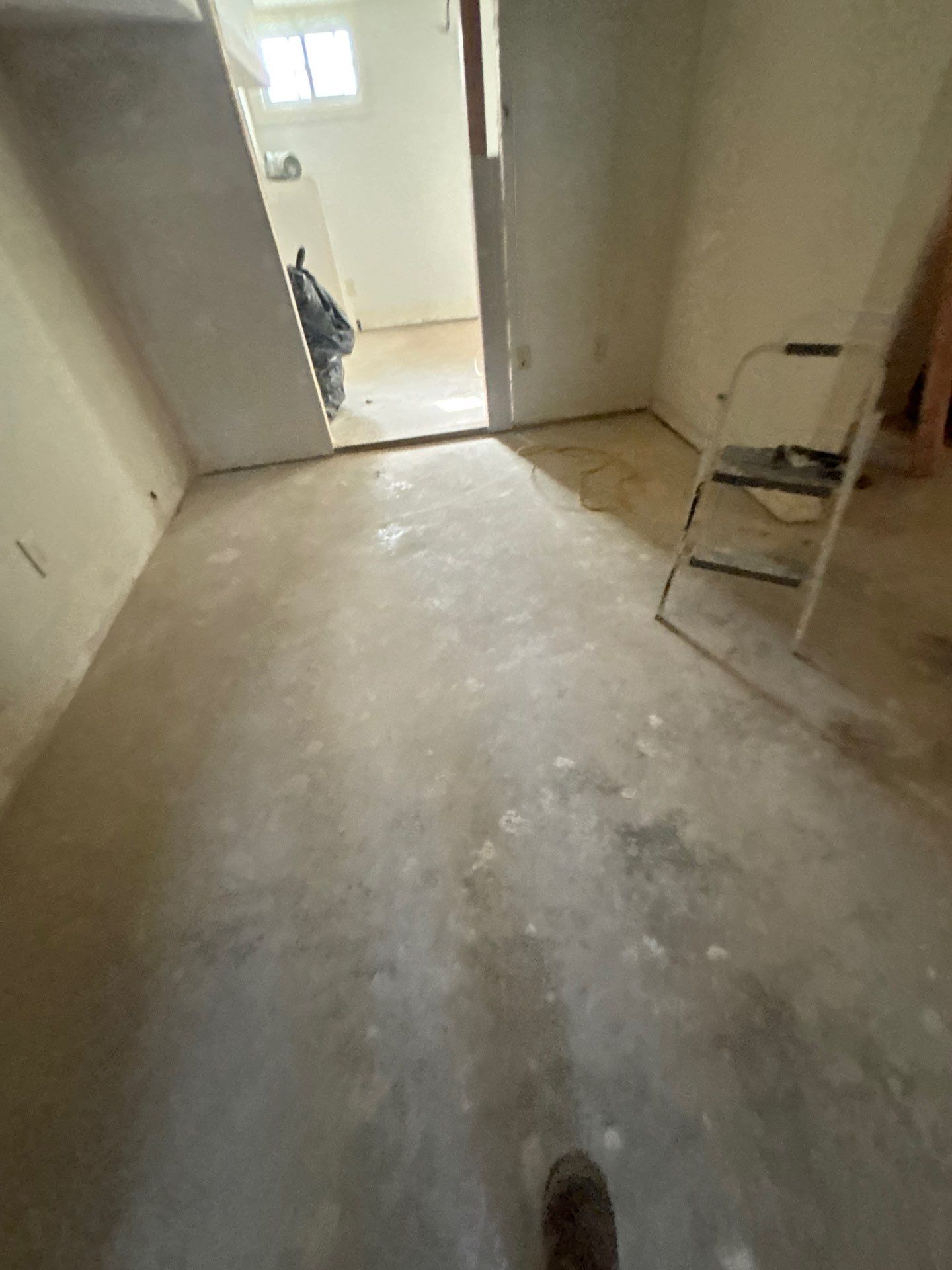 Comprehensive Basement Concrete Floor Coating and Crack Repair in Sioux Falls by Select Painting, Coatings & Garage Cabinets