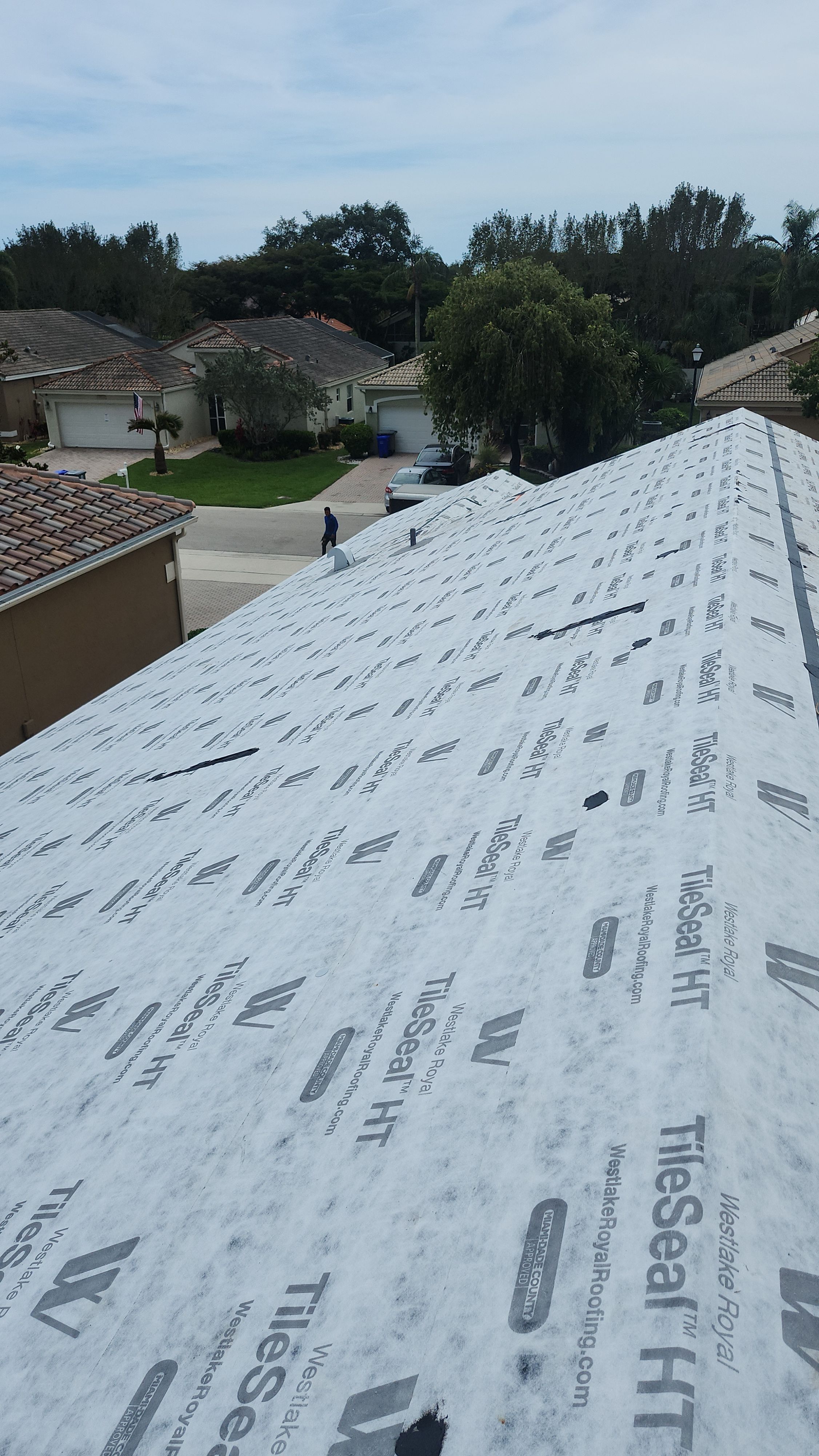 New Barrel Tile Roof Installation and Decking Repair in Boynton Beach by Aastro Roofing