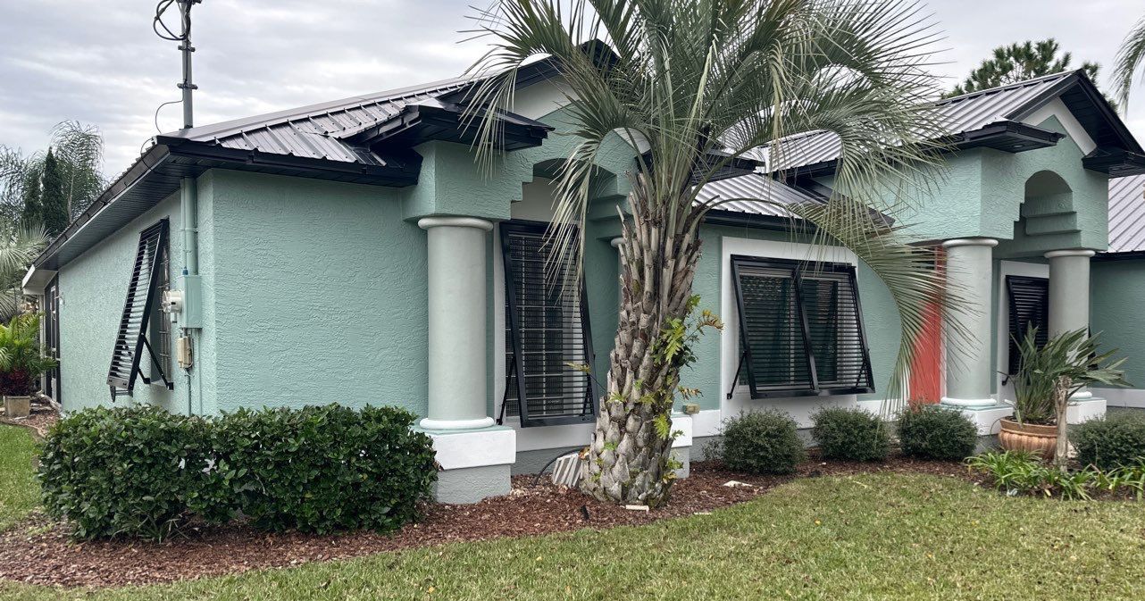 Bahama Shutters in Jet Black by Smart Guard Shutters