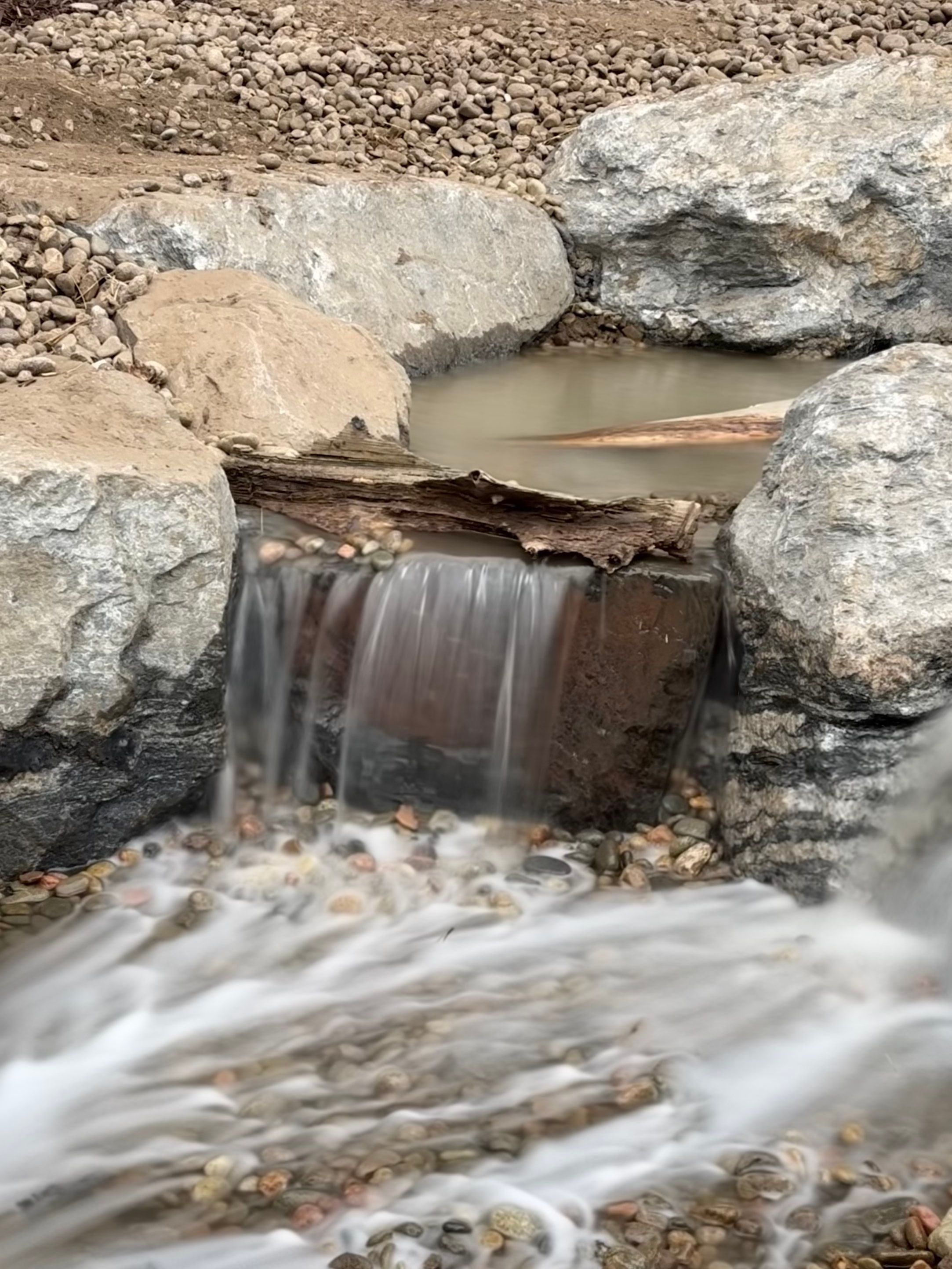 large waterfall and deck by JRM landscape & design