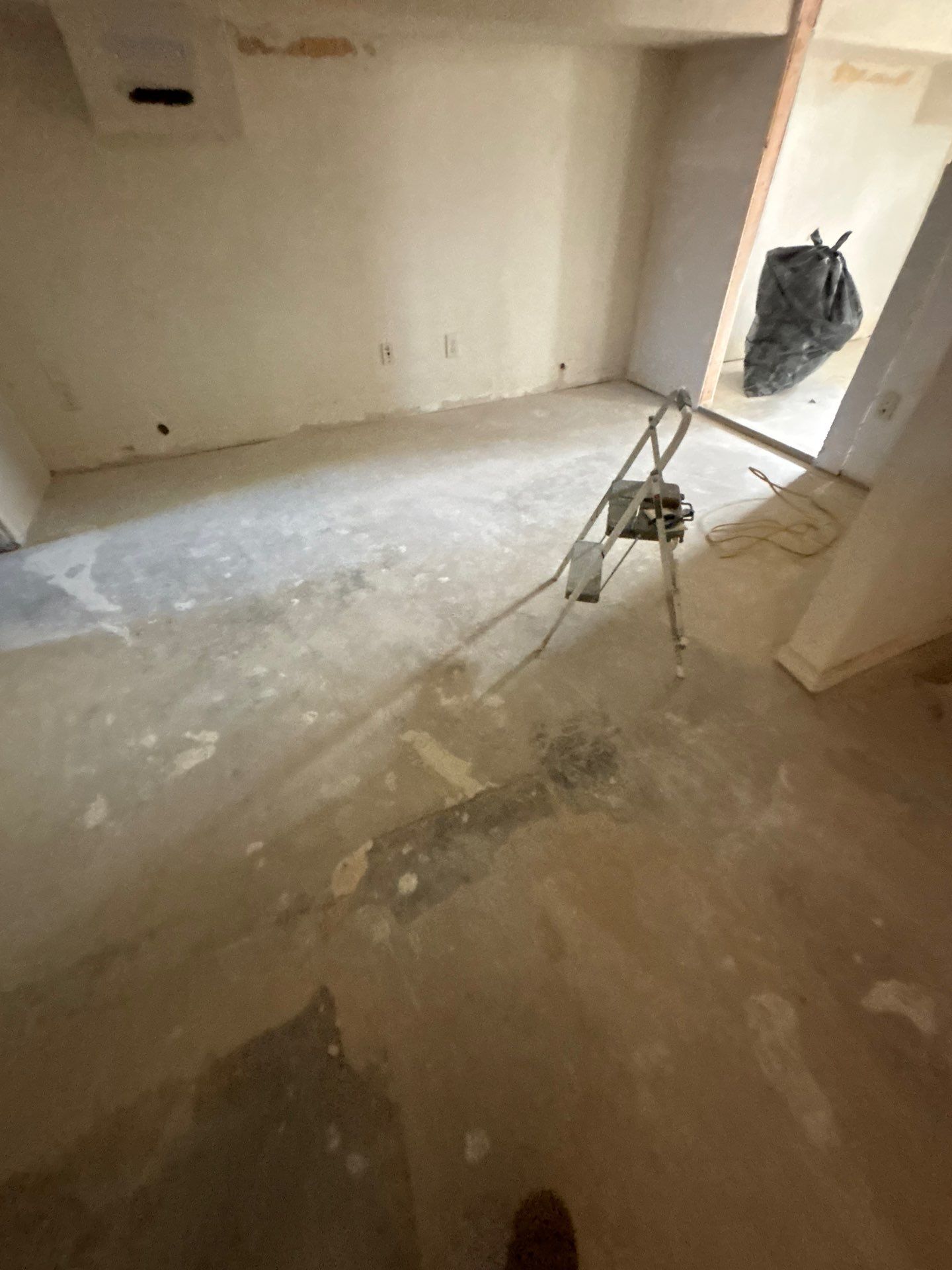 Comprehensive Basement Concrete Floor Coating and Crack Repair in Sioux Falls by Select Painting, Coatings & Garage Cabinets
