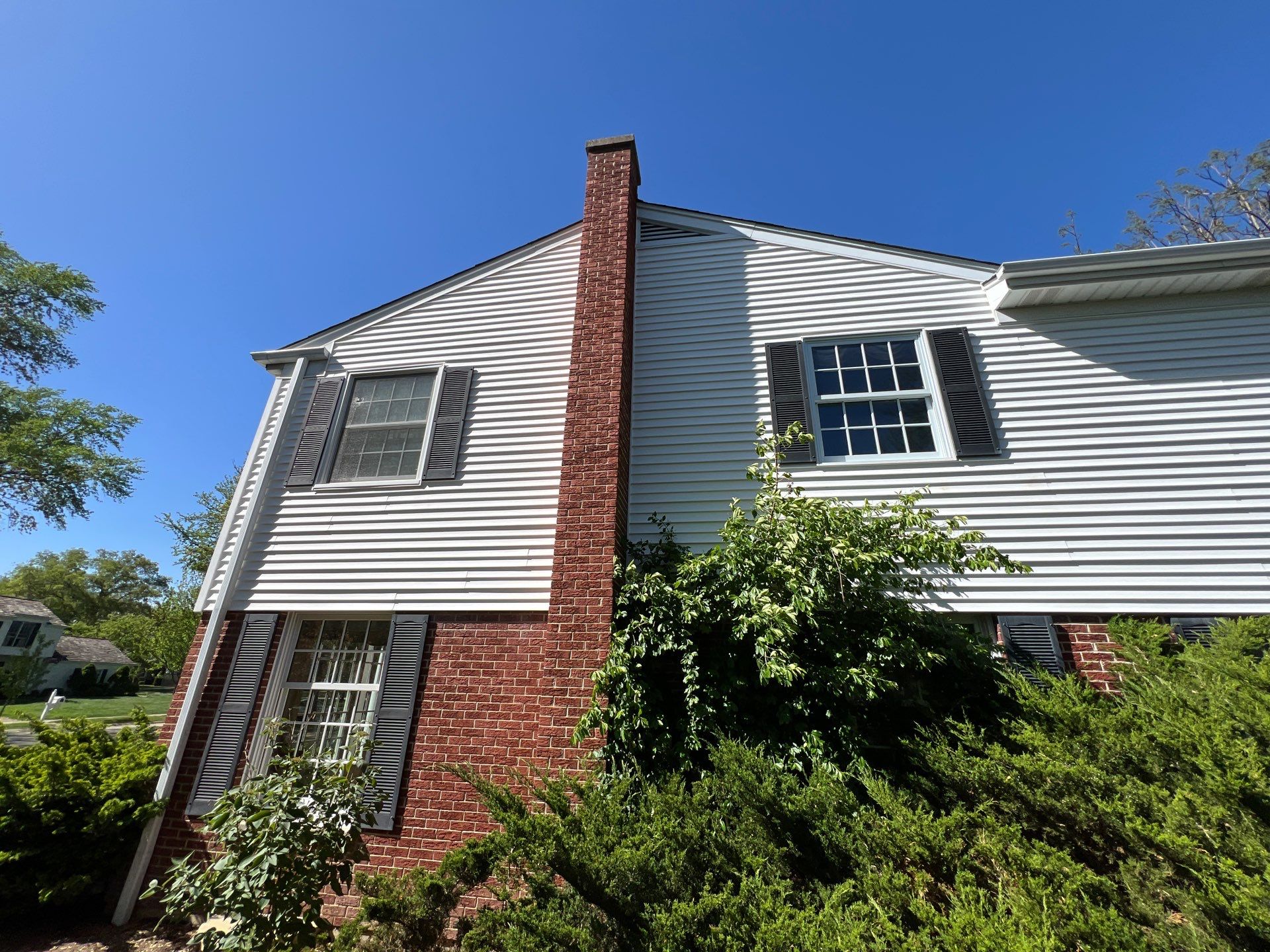 Housewashing  using Algaecide, soft wash soap by Northern Power Washing LLC.