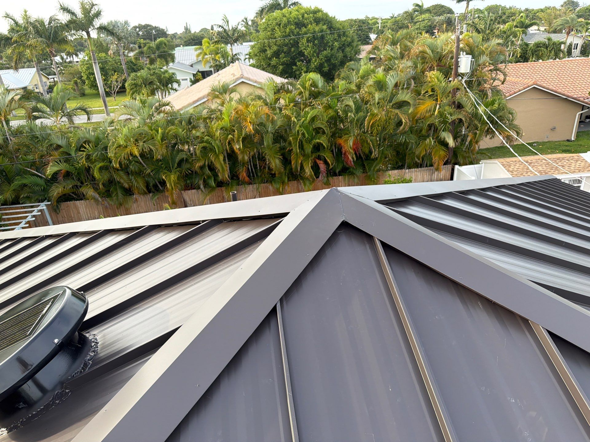 Residential Roofing Installation using 1.5'' Mechanical Seam by BLUES BROTHERS ROOFING