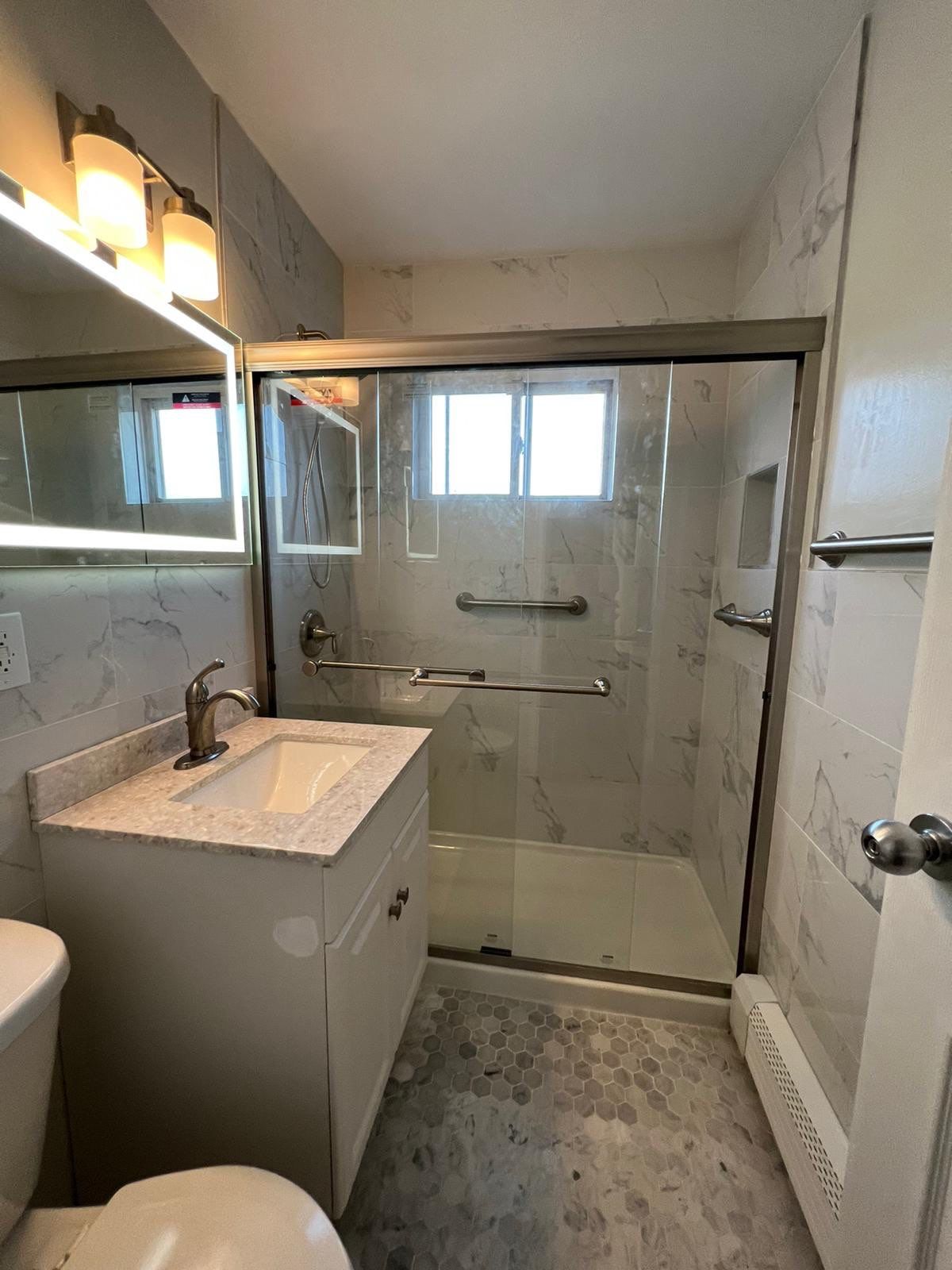 Bathroom Remodel using Tile by Home Concepts Construction