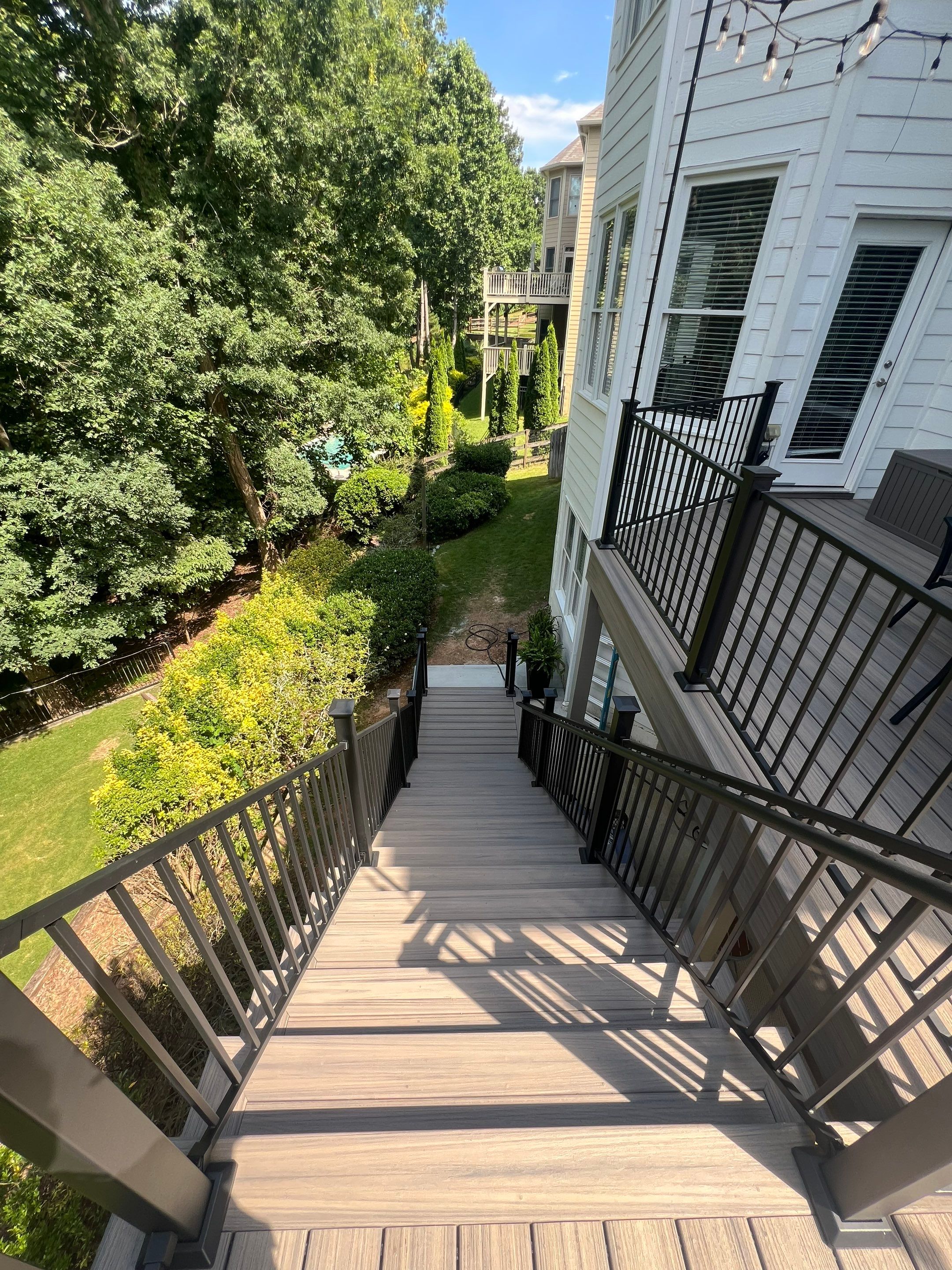 Elevated Composite Deck and Concrete Landing Installation in Kennesaw by Swift Home Renovations