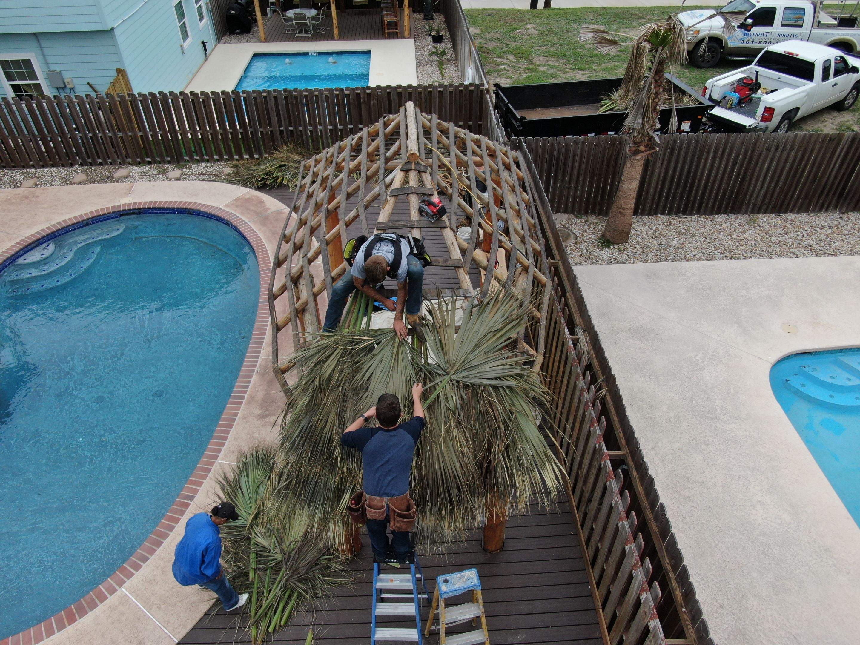 Poolside paradise by Bayfront Roofing and Construction